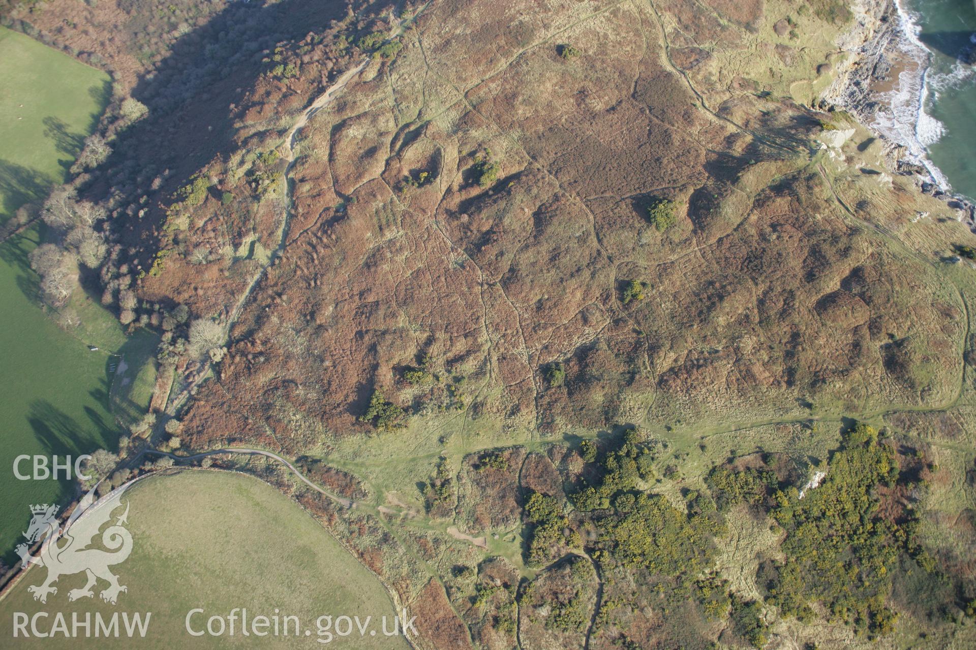 RCAHMW colour oblique aerial photograph of the presumed site of the Penmaen Burrows Deserted Settlement from the south-west. Taken on 26 January 2006 by Toby Driver.