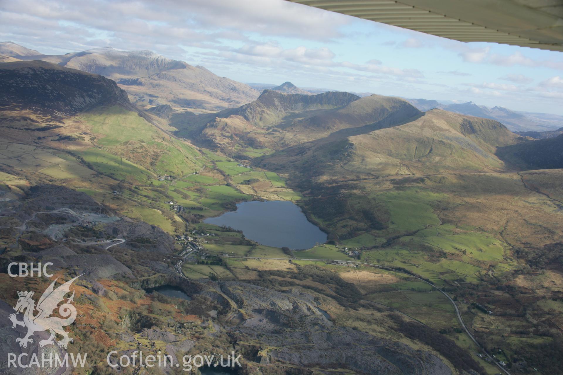 RCAHMW colour oblique aerial photograph of Dorothea Quarry. A general view from the west showing the landscape over Nantlle. Taken on 09 February 2006 by Toby Driver.