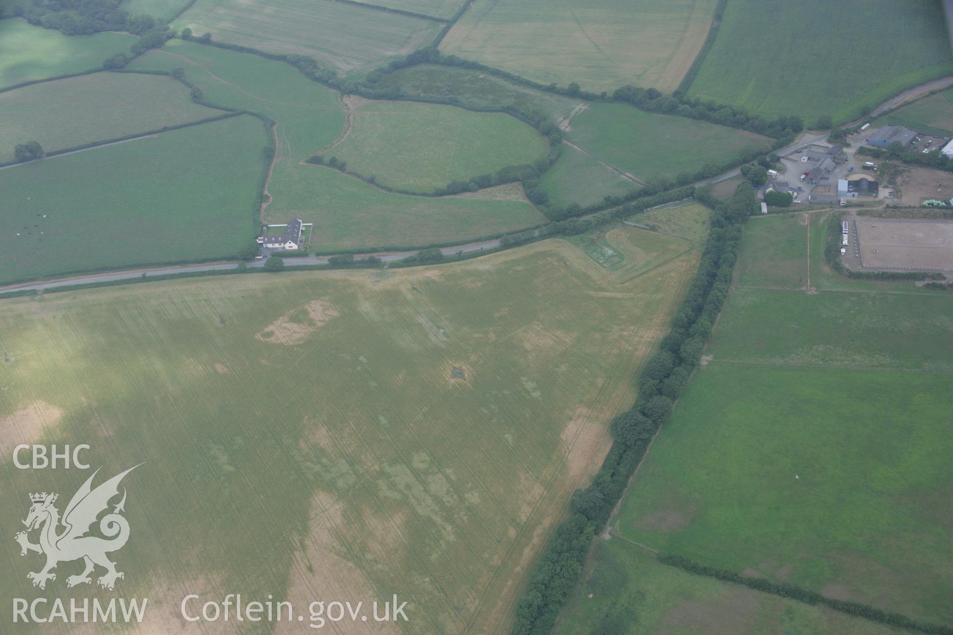 RCAHMW colour oblique aerial photograph of the Roman road west of Carmarthen at Broadway with the road showing as a cropmark. Taken on 21 July 2006 by Toby Driver.