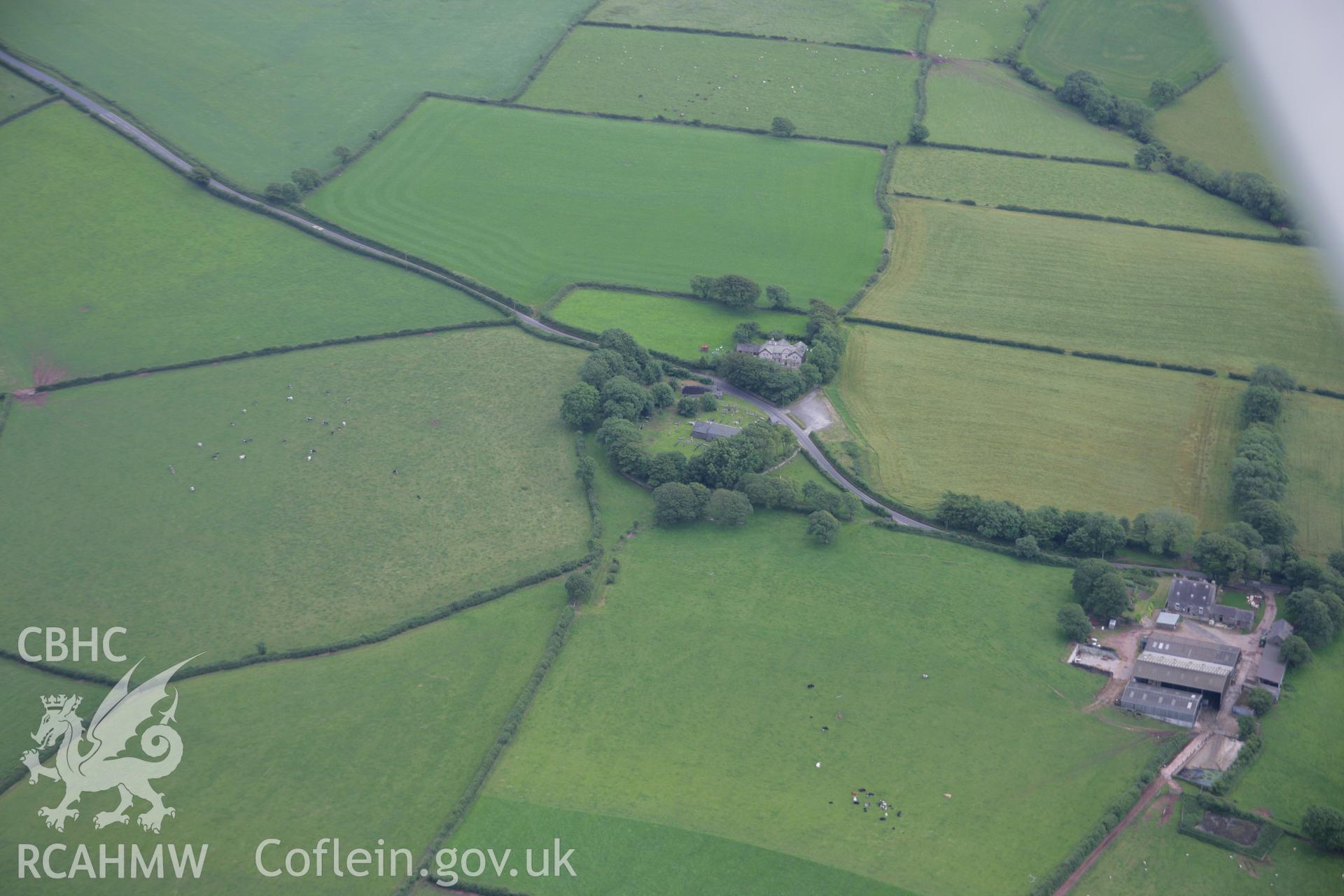 RCAHMW colour oblique aerial photograph of St Margaret's Church, Eglwyscumin. Taken on 11 July 2006 by Toby Driver.