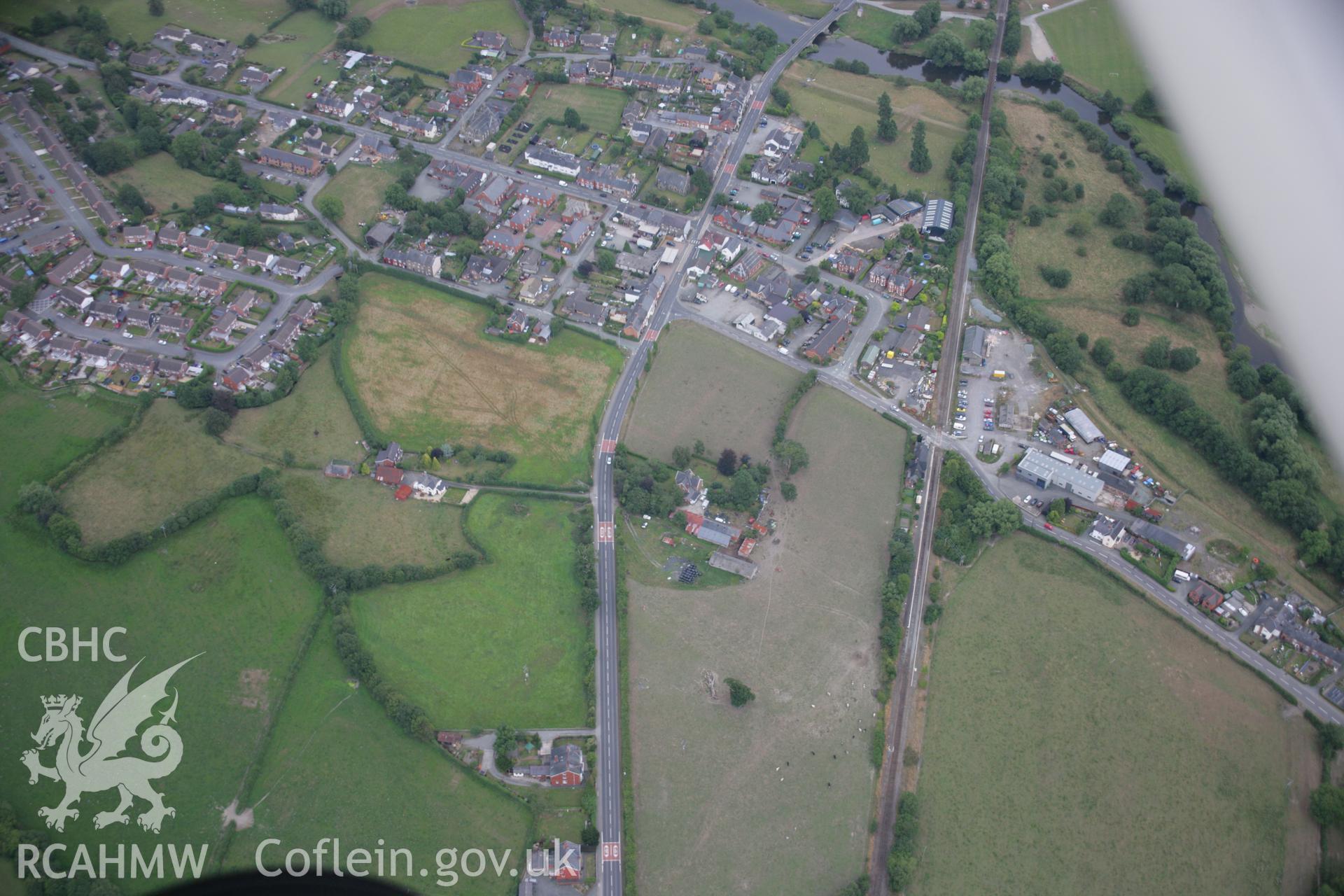 RCAHMW colour oblique aerial photograph of Caersws Roman Military Settlement. Taken on 14 August 2006 by Toby Driver.