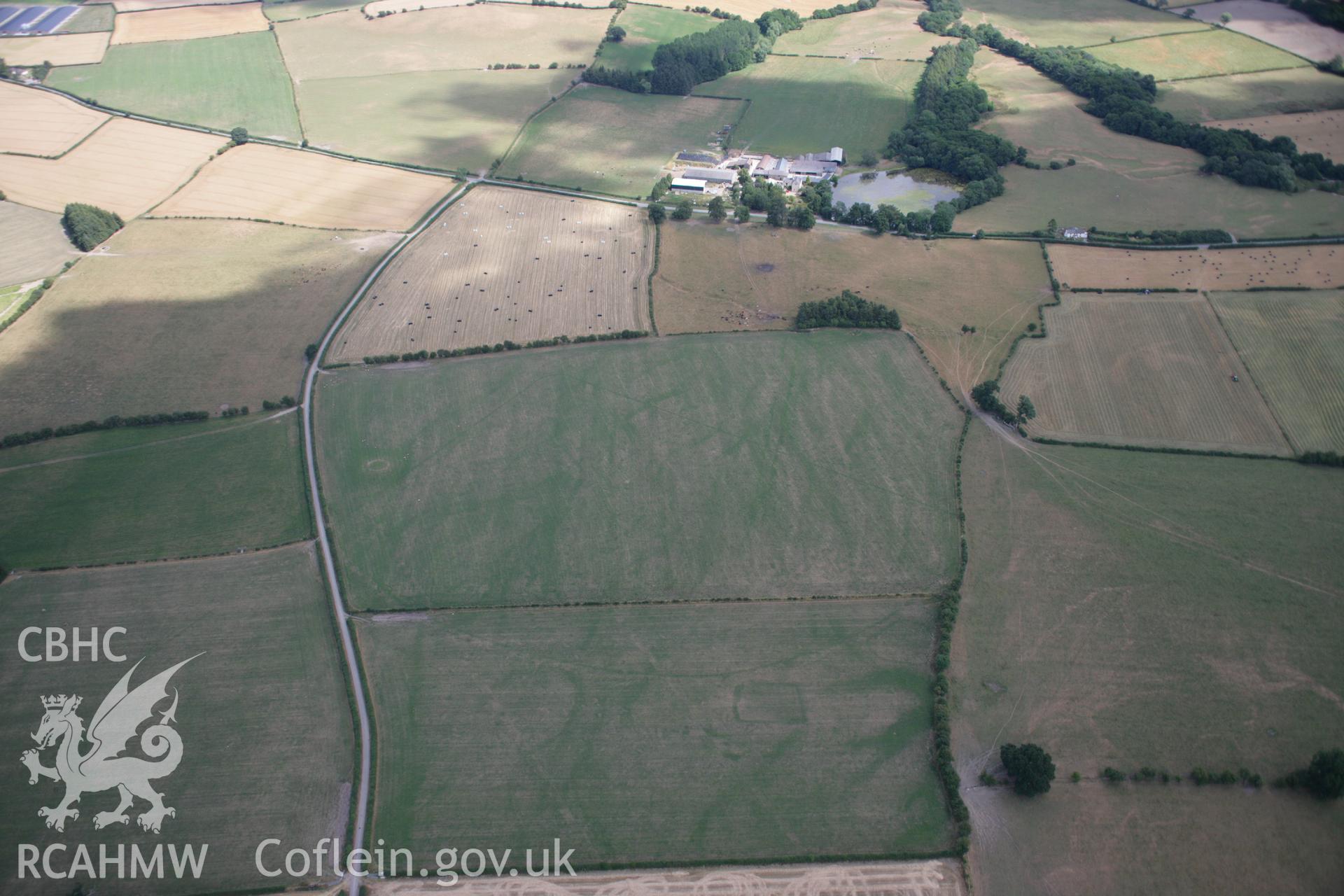 RCAHMW colour oblique aerial photograph of Hindwell Pallisaded Enclosure and Roman Camp. Taken on 27 July 2006 by Toby Driver.