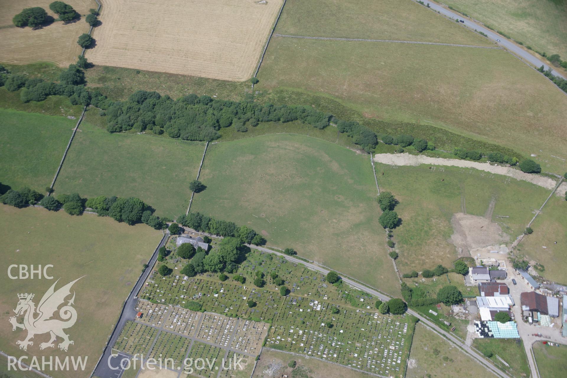 RCAHMW colour oblique aerial photograph of St Michaels Church showing nearby parchmarks. Taken on 18 July 2006 by Toby Driver.