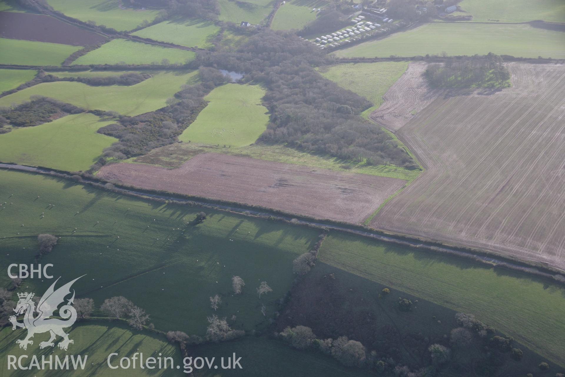 RCAHMW colour oblique aerial photograph showing non-archaeological soilmarks, Lower Bubbleton, near Palmerslake Farmhouse, Penally, viewed from the north-west. Taken on 11 January 2006 by Toby Driver