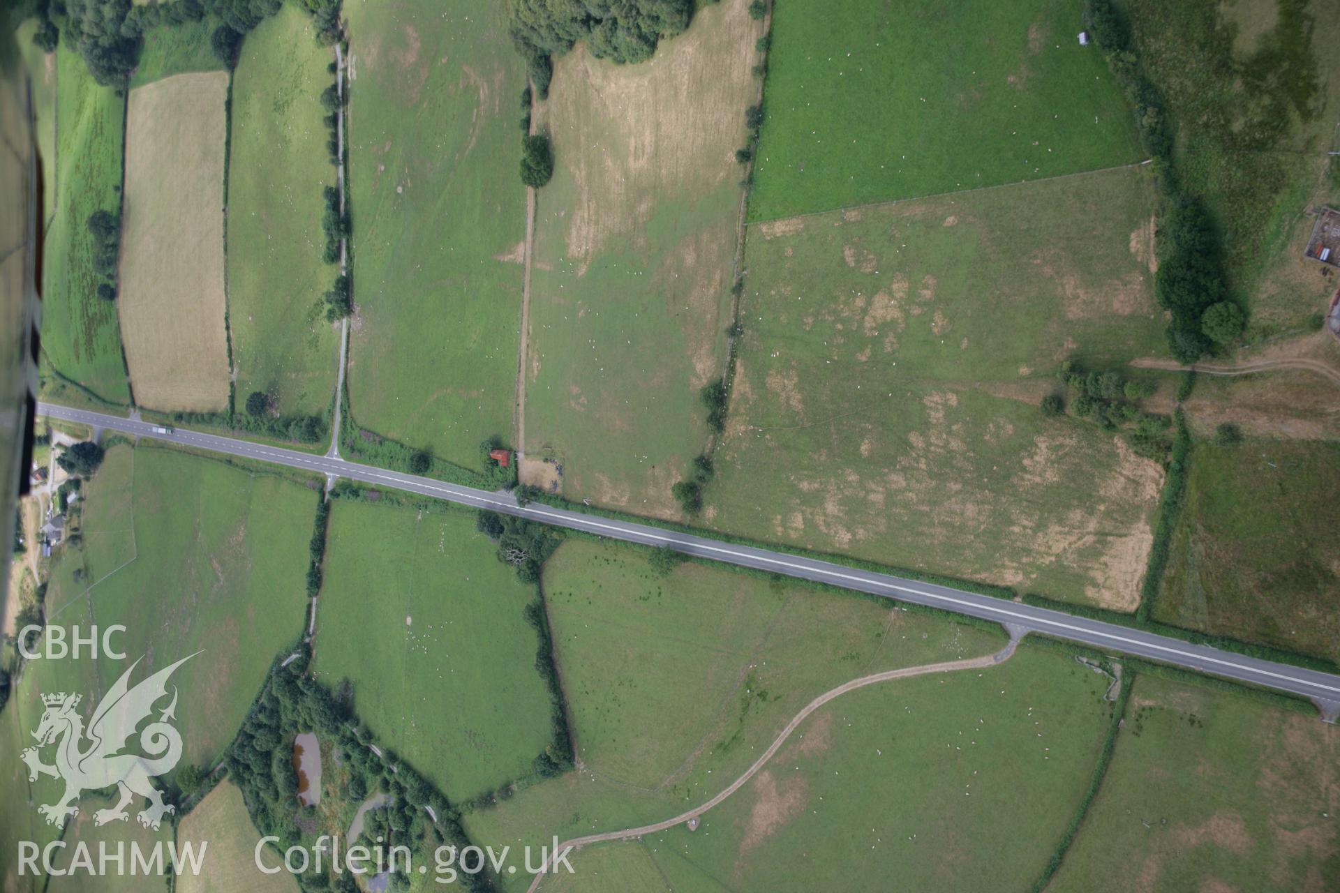 RCAHMW colour oblique aerial photograph showing parchmarks to south of Nantmel Marching Camp. Taken on 27 July 2006 by Toby Driver.