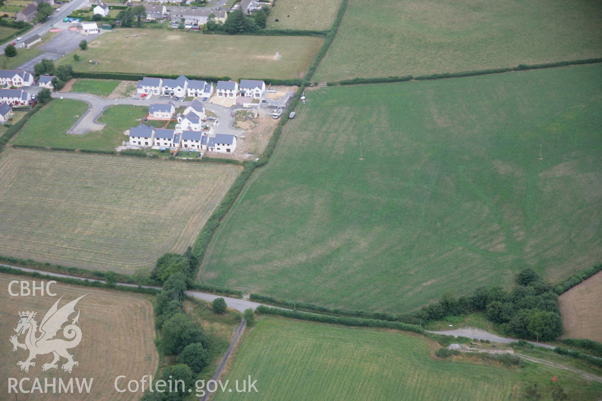 RCAHMW colour oblique aerial photograph of Y Gaer, Clynderwen showing possible parchmarks. Taken on 27 July 2006 by Toby Driver