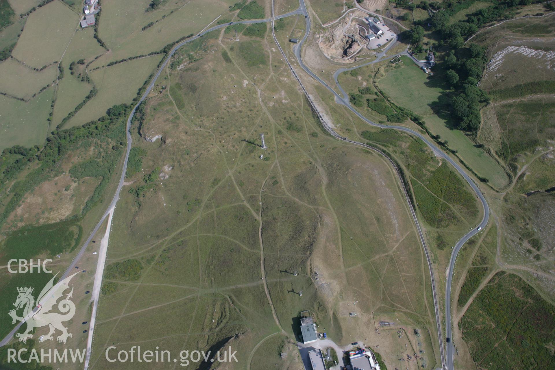 RCAHMW colour oblique aerial photograph of Bryniau Poethion Hut Circle. Taken on 14 August 2006 by Toby Driver.