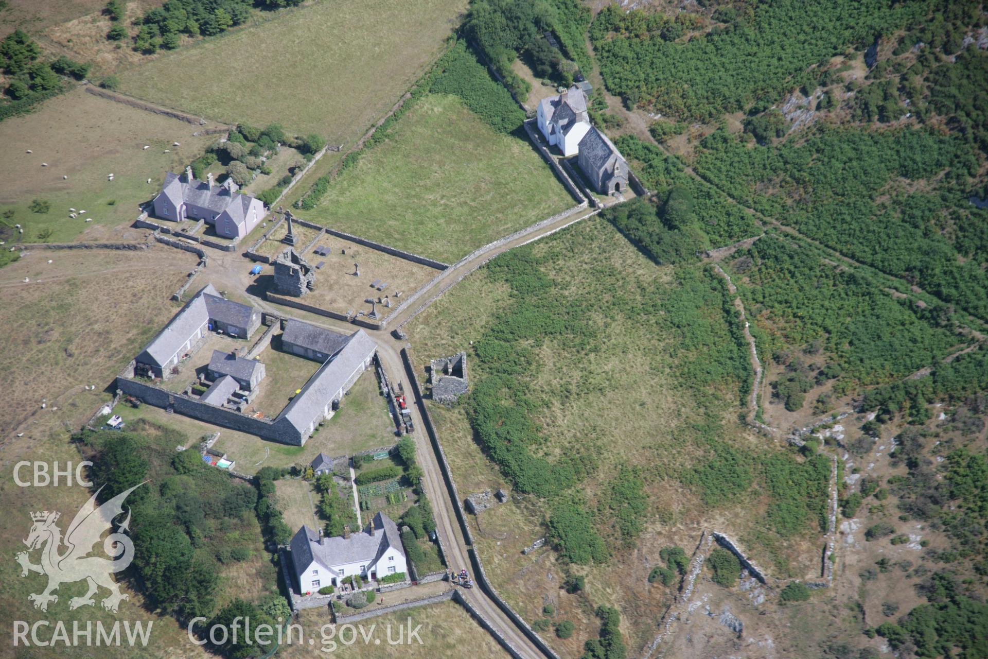 RCAHMW colour oblique aerial photograph of St Mary's Abbey, Bardsey Island, from the north-east. Taken on 03 August 2006 by Toby Driver.