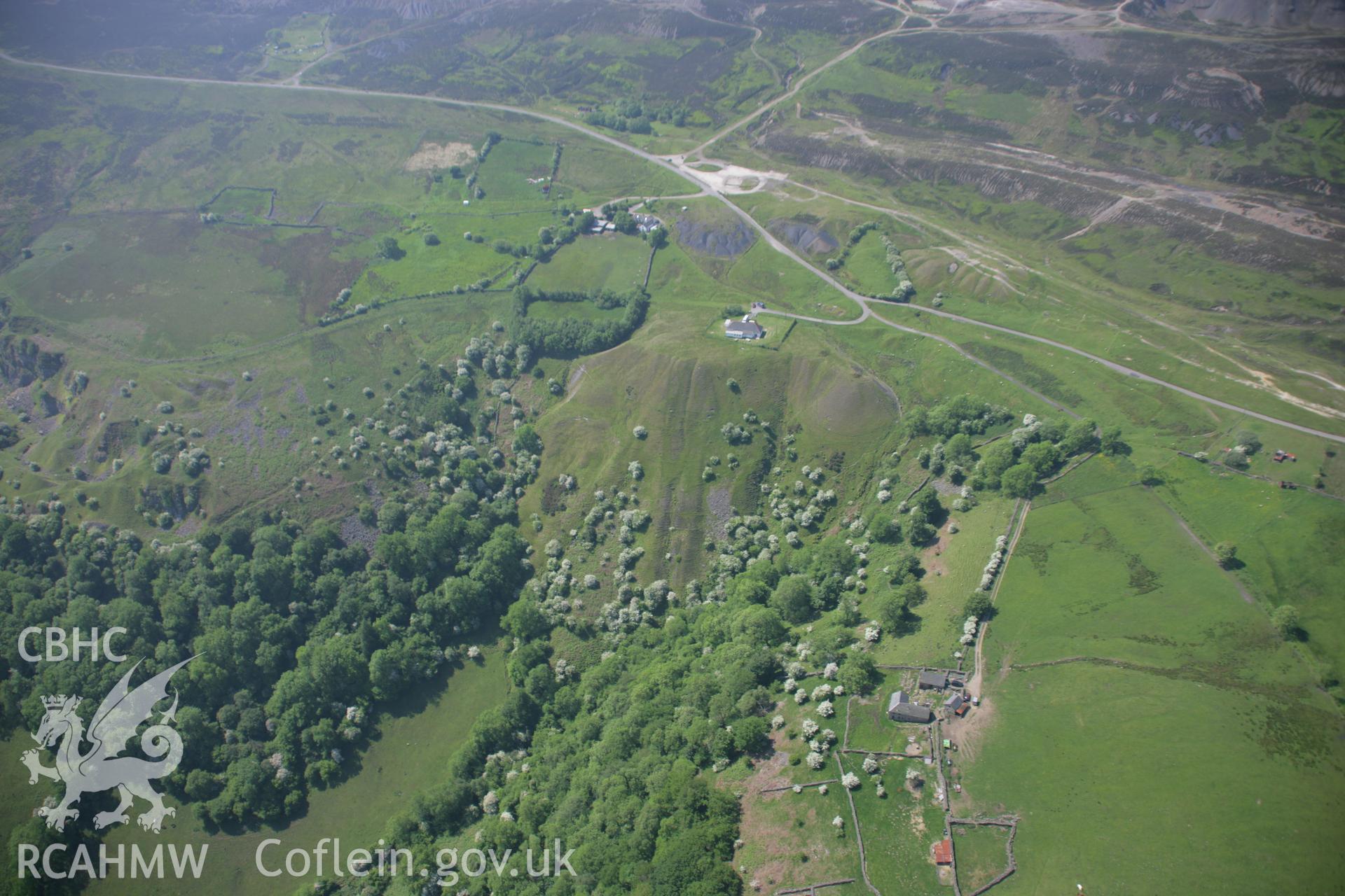 RCAHMW colour oblique aerial photograph of the north-east portal of the Pwll Du Tunnel on Hill's Tramroad, from the north-east. Taken on 09 June 2006 by Toby Driver.