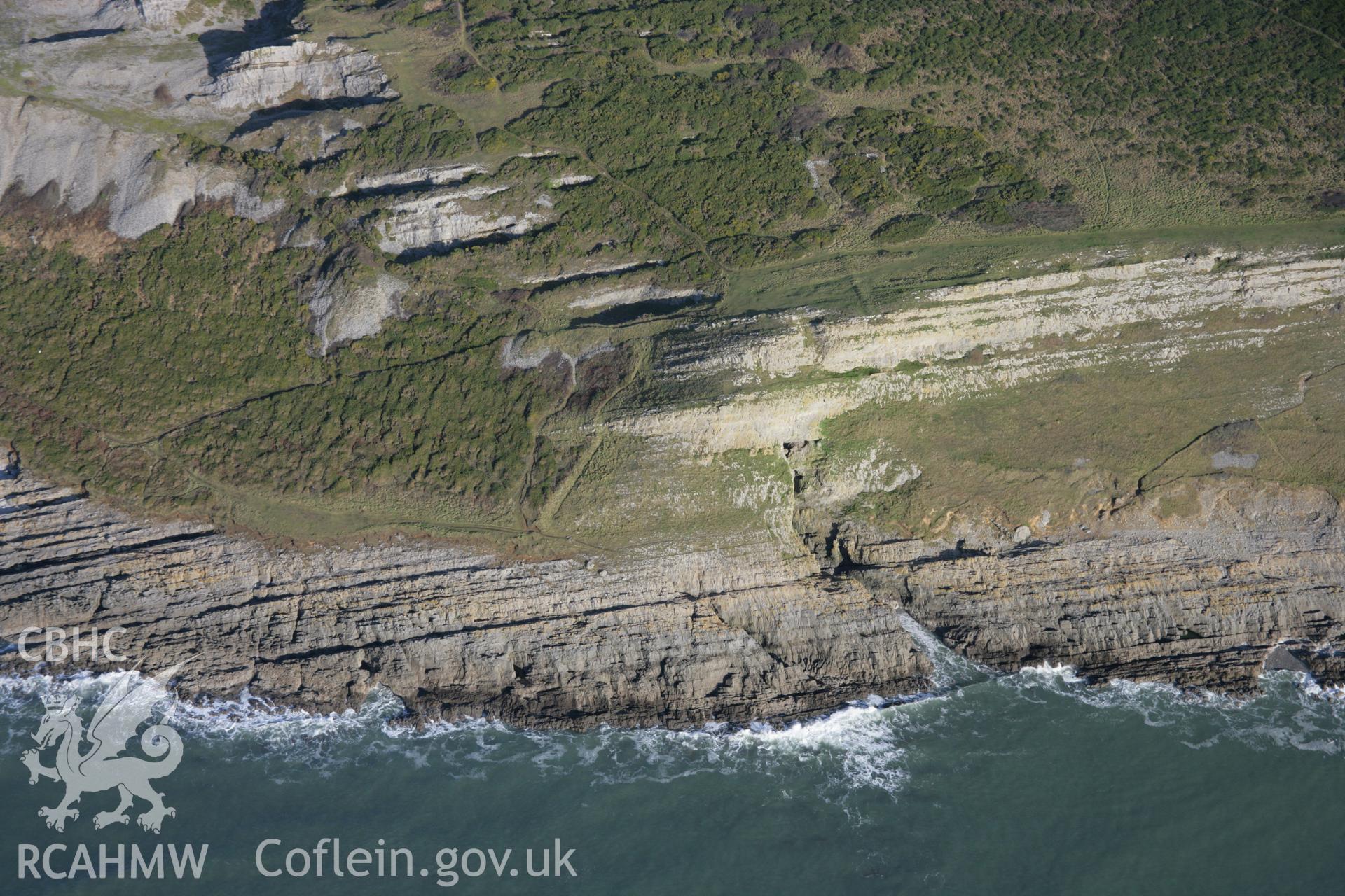 RCAHMW colour oblique aerial photograph of Culver Hole Dovecote. A view of the cliffs to the west taken from the south-west. Taken on 26 January 2006 by Toby Driver.