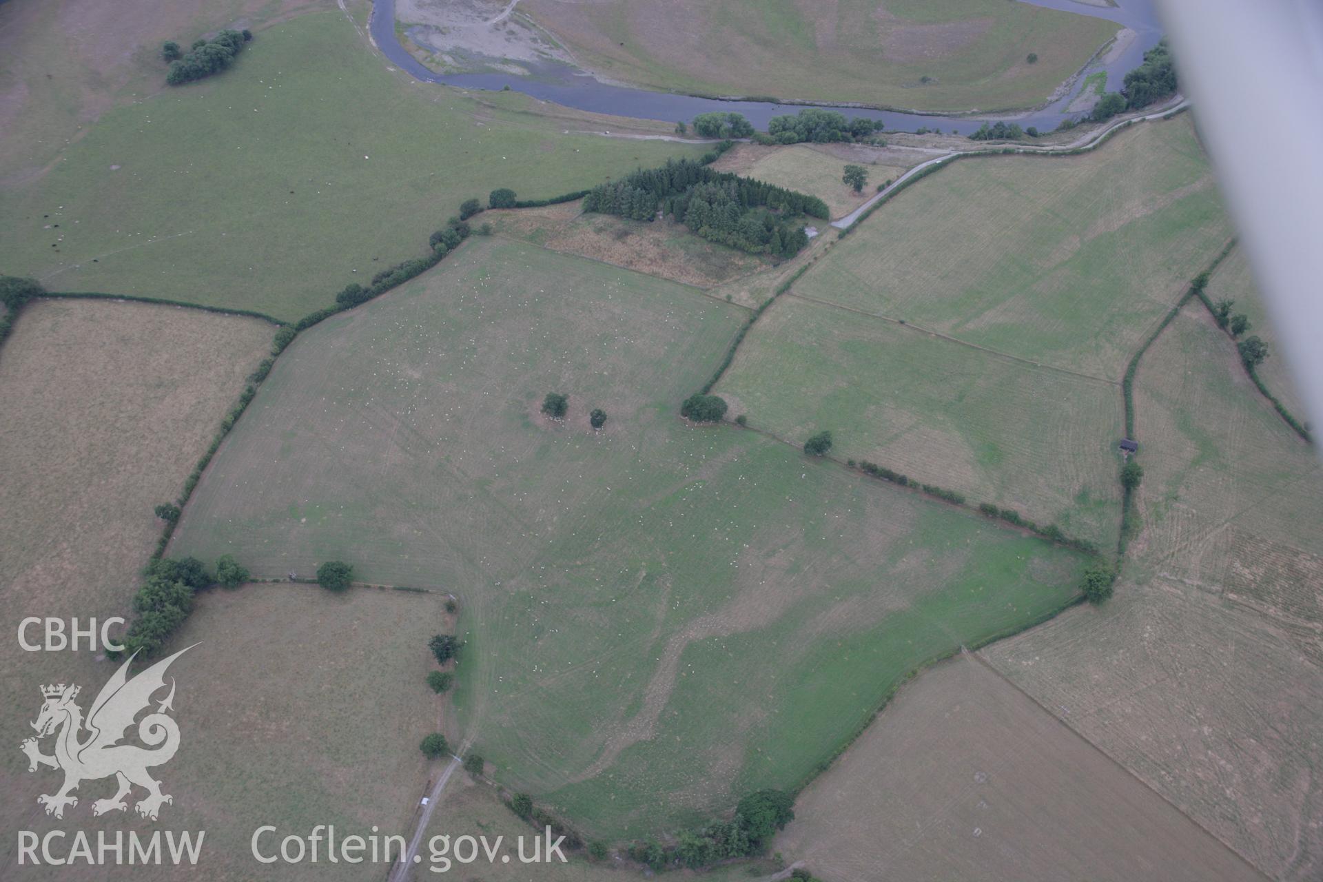 RCAHMW colour oblique aerial photograph showing parchmarks in grass at Llwyn-y-Brain Roman Fort. Taken on 14 August 2006 by Toby Driver.