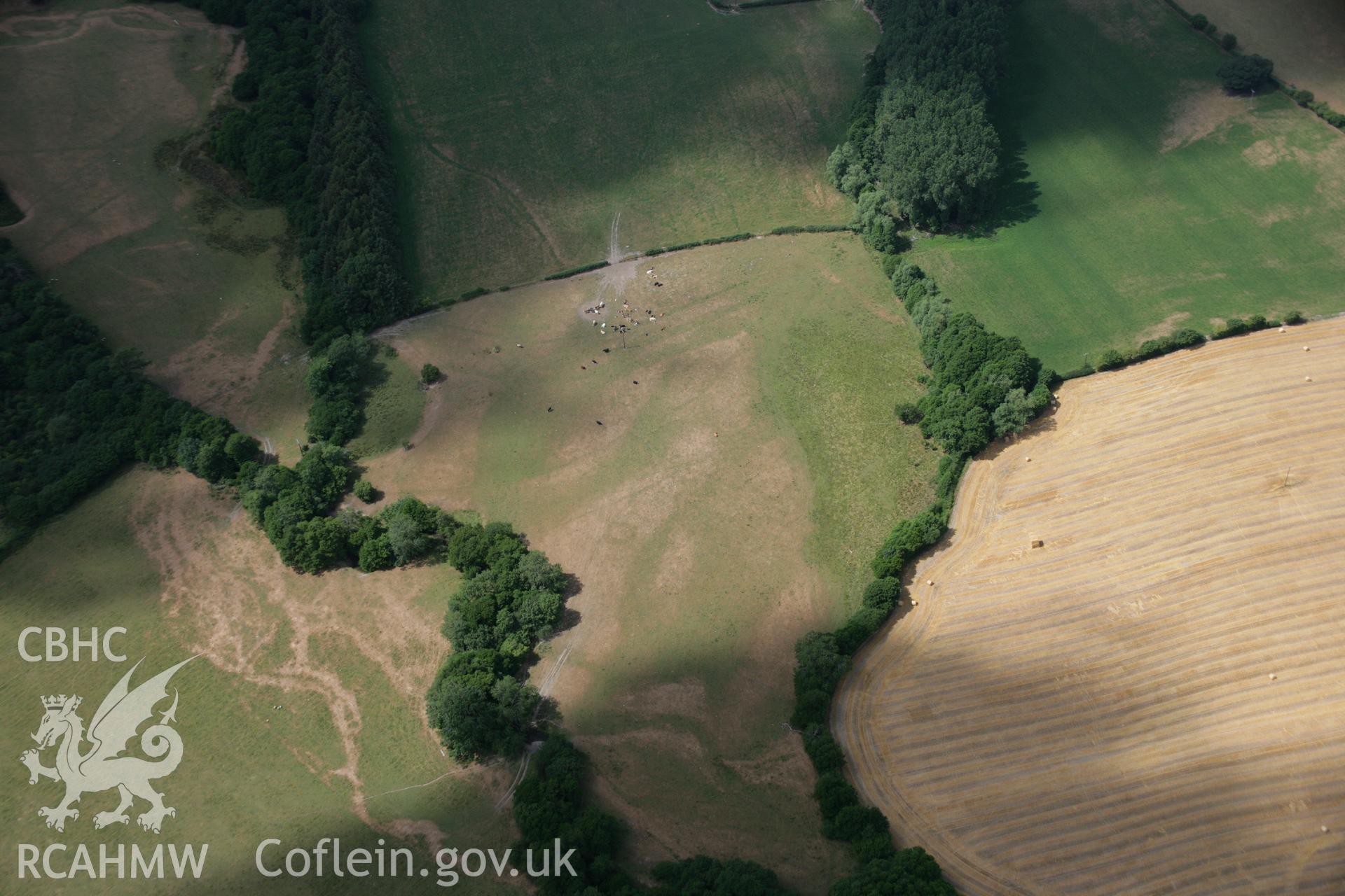 RCAHMW colour oblique aerial photograph of Hindwell Ditches and Ring Ditch cropmarks. Taken on 27 July 2006 by Toby Driver.