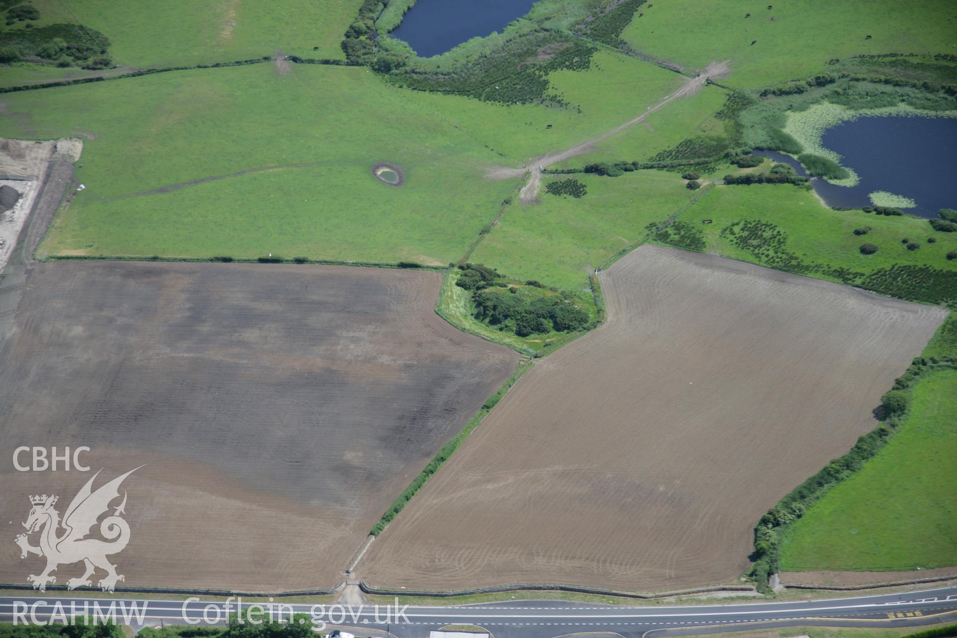 RCAHMW colour oblique aerial photograph of Tomen Fawr from the north. Taken on 14 June 2006 by Toby Driver.