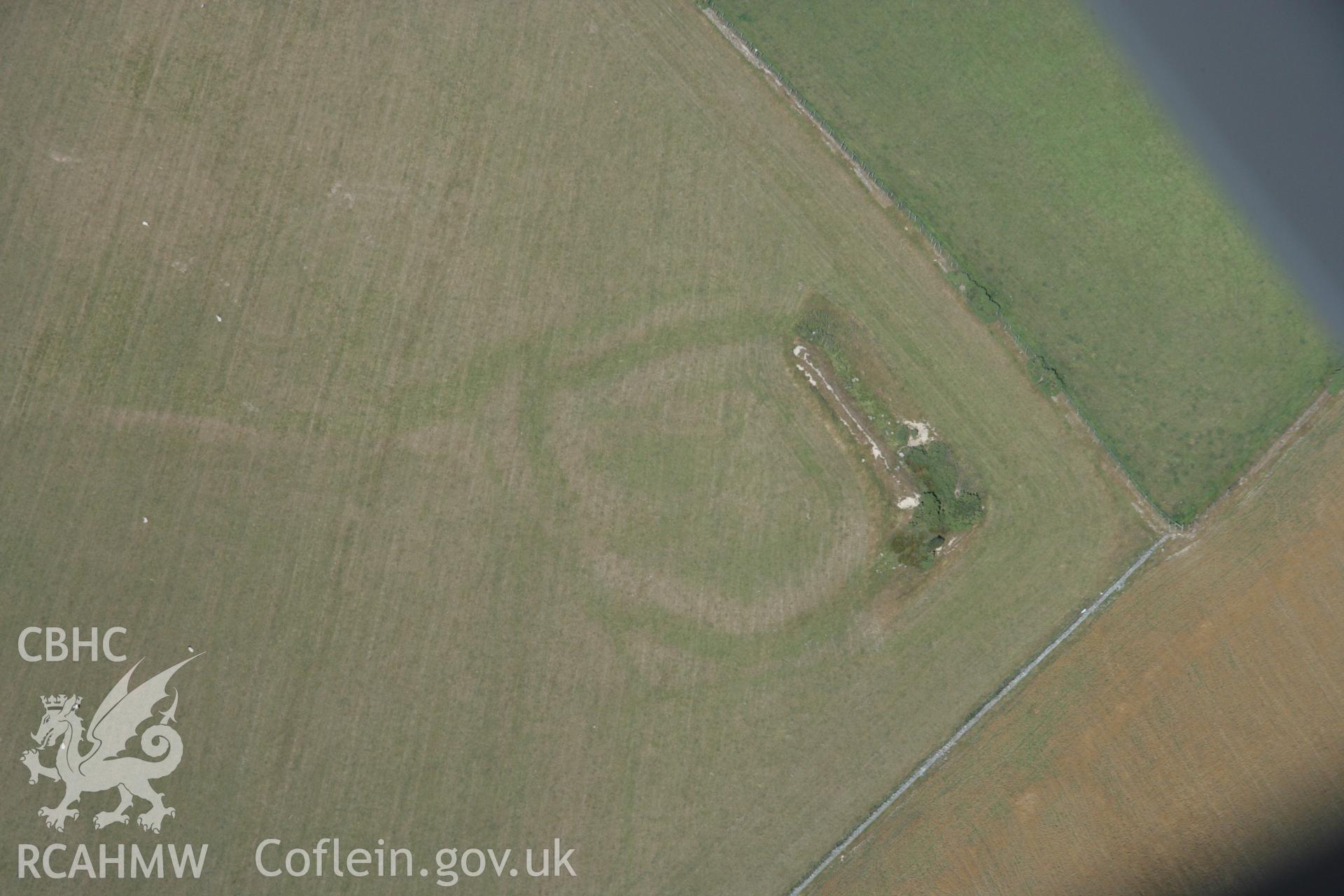 RCAHMW colour oblique aerial photograph of an earthwork enclosure at Llifad. Taken on 14 August 2006 by Toby Driver.