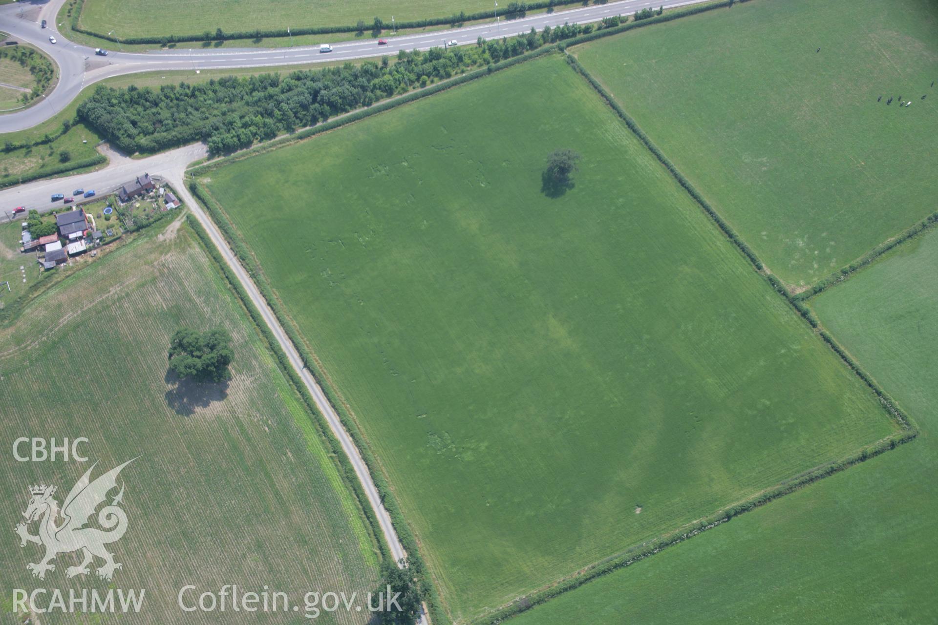 RCAHMW colour oblique aerial photograph of Sarn-y-Bryn Caled. Taken on 04 July 2006 by Toby Driver