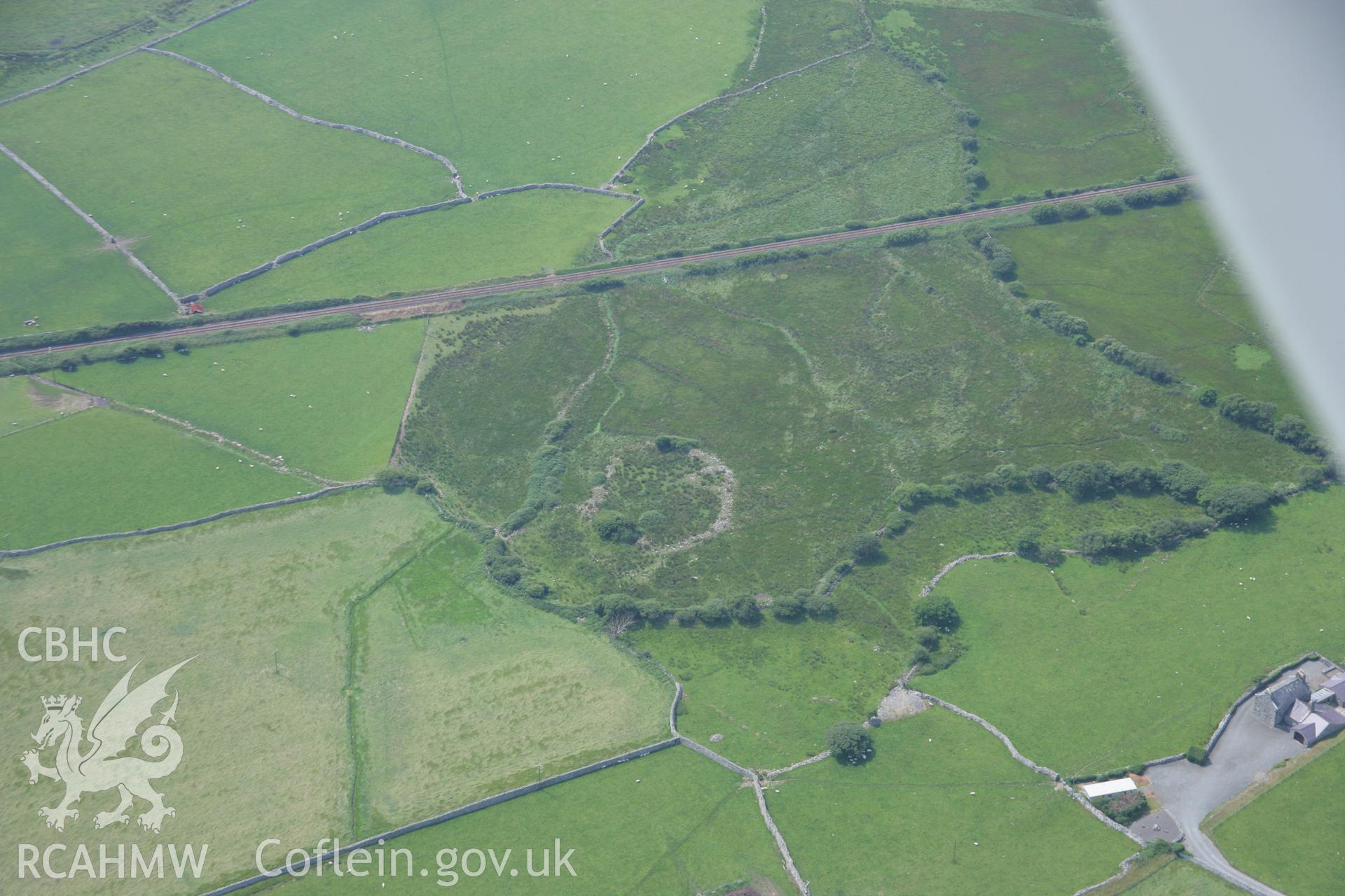 RCAHMW colour oblique aerial photograph of a homestead at Sebonig. Taken on 04 July 2006 by Toby Driver.