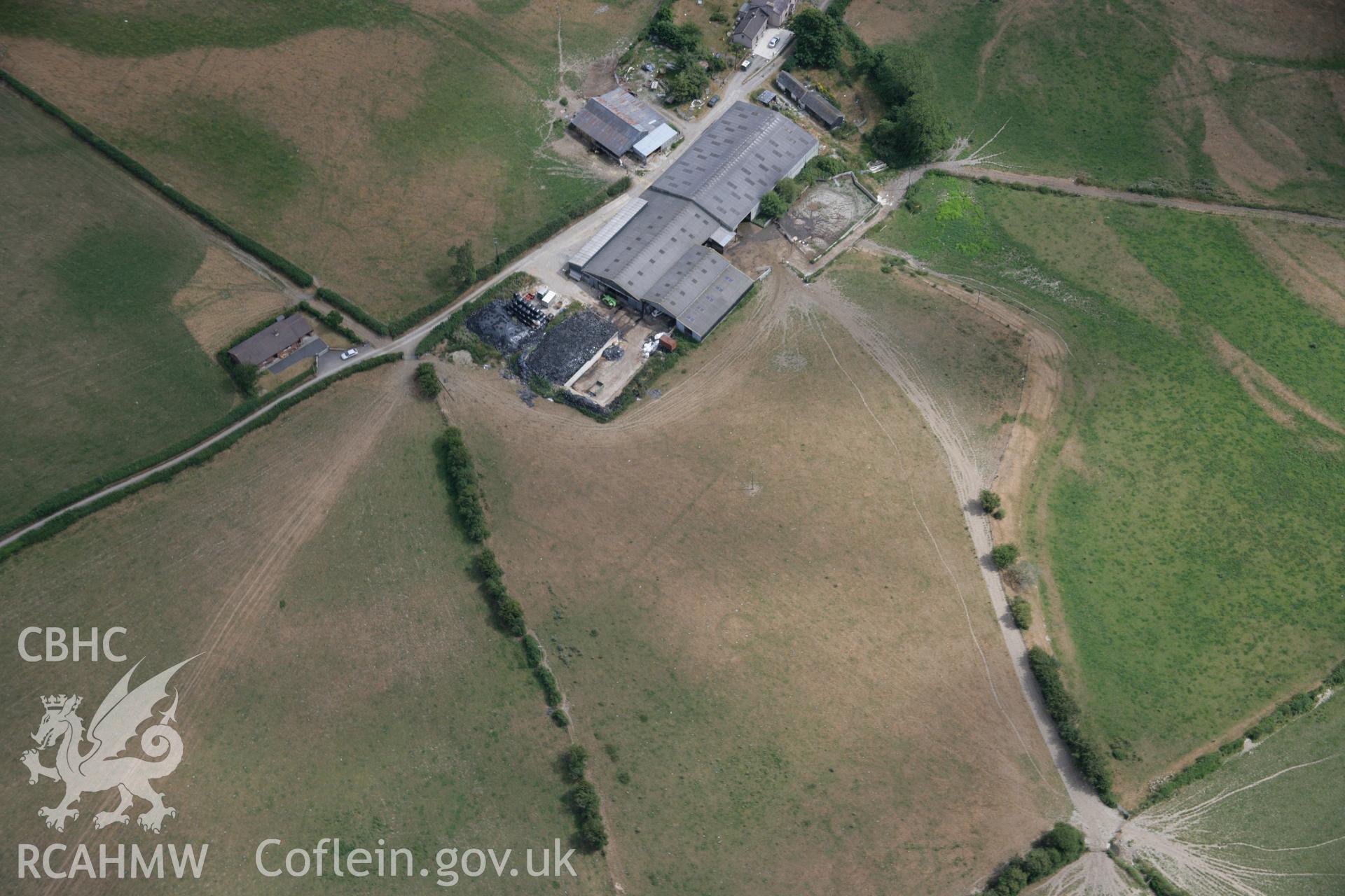 RCAHMW colour oblique aerial photograph of the rectangular enclosure and barrows at Pyllau-Isaf South. Taken on 27 July 2006 by Toby Driver.