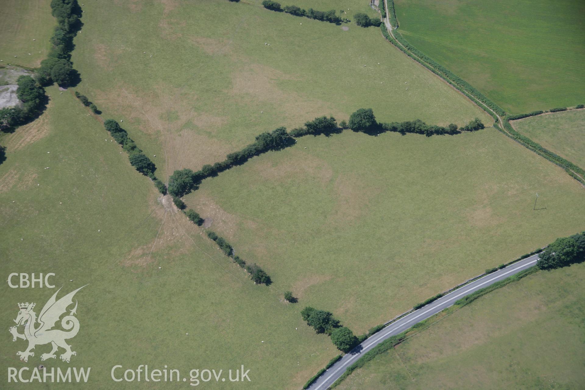 RCAHMW colour oblique aerial photograph of Erglodd Roman Military Settlement. Taken on 17 July 2006 by Toby Driver.