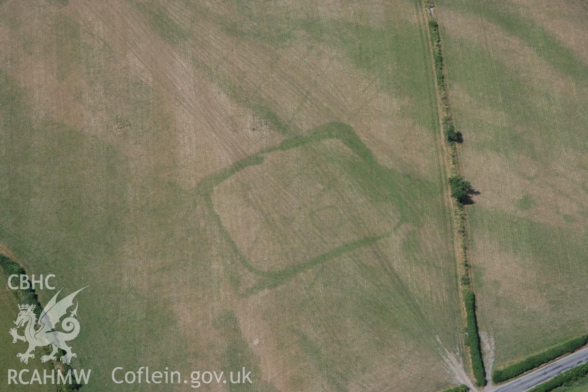 RCAHMW colour oblique aerial photograph of cropmark enclosures west of Caerau. Taken on 27 July 2006 by Toby Driver.