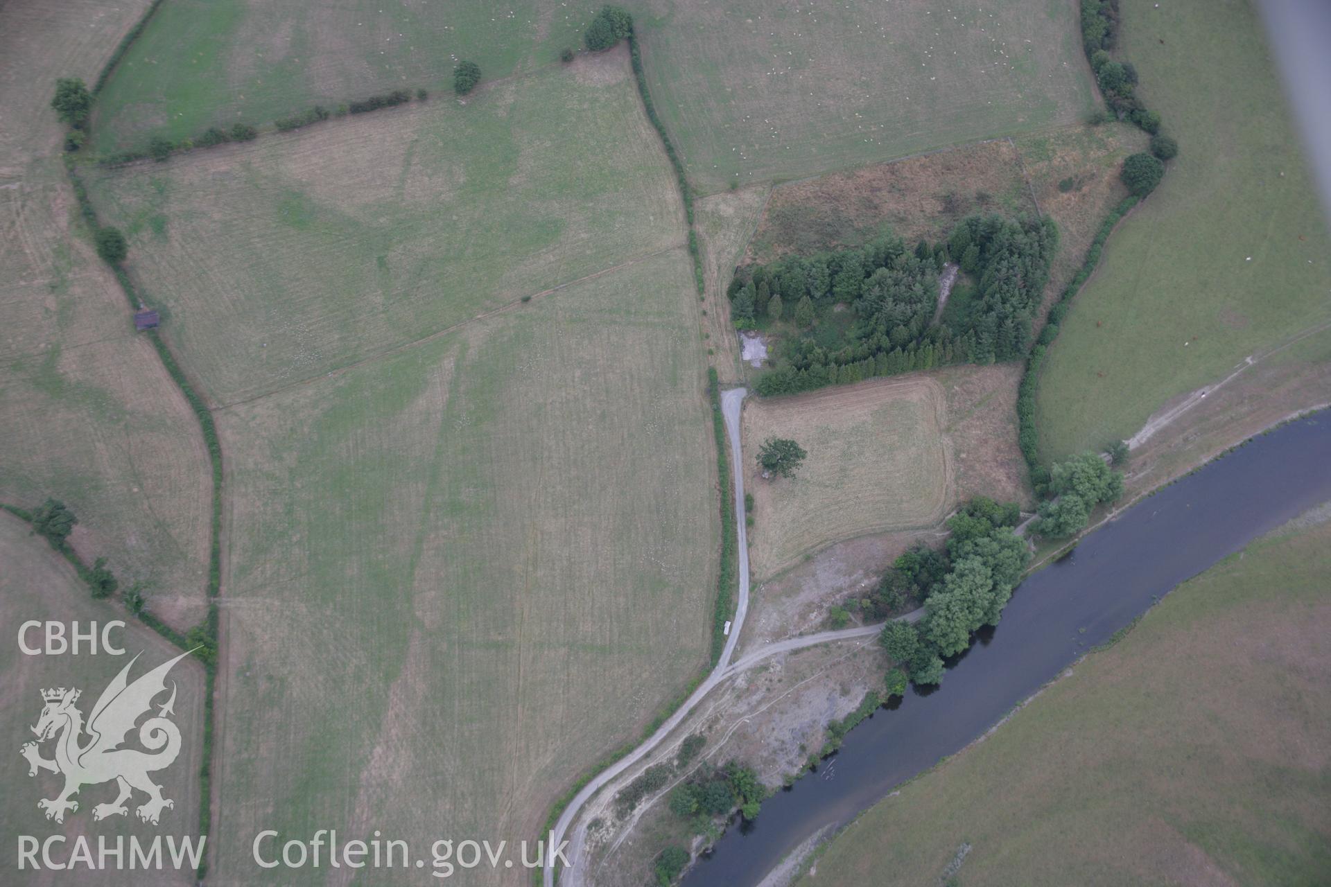 RCAHMW colour oblique aerial photograph showing parchmarks in grass at Llwyn-y-Brain Roman Fort. Taken on 14 August 2006 by Toby Driver.