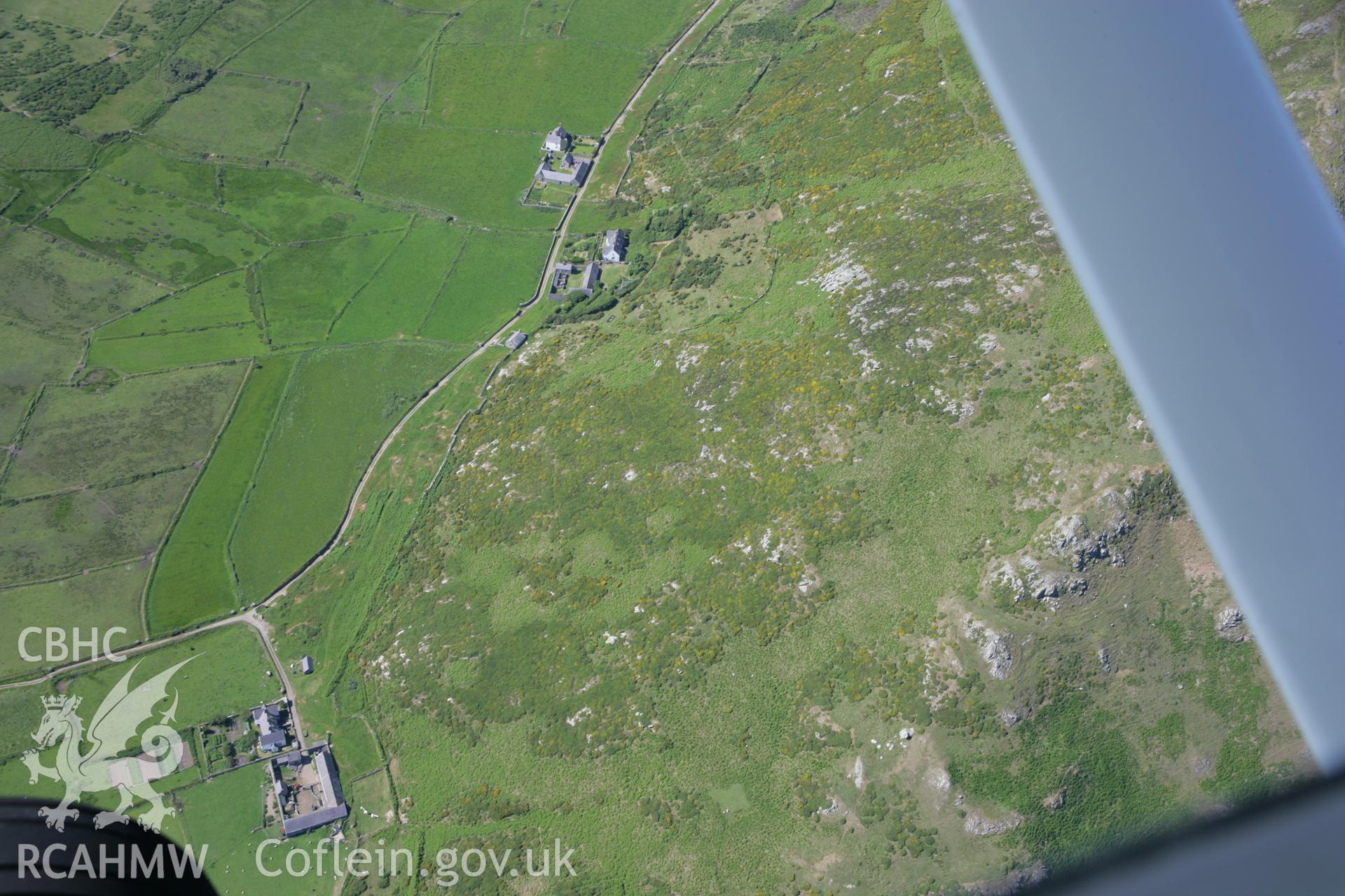 RCAHMW colour oblique aerial photograph of Mynydd Enlli huts, viewed from the south-east. Taken on 14 June 2006 by Toby Driver