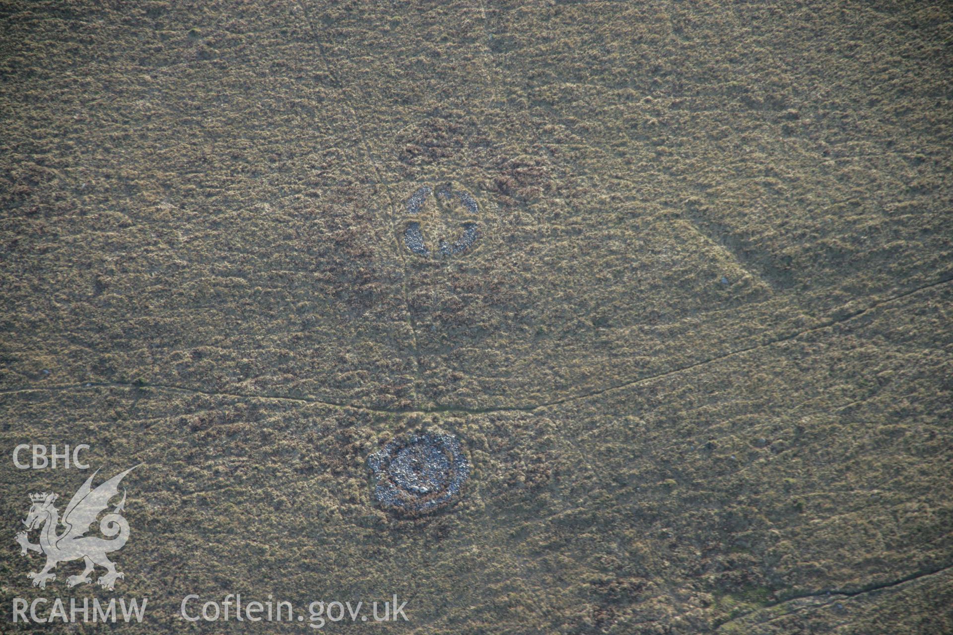 RCAHMW colour oblique aerial photograph of a cairn to the north of the Great Cairn on Cefn Bryn, viewed from the north. Taken on 26 January 2006 by Toby Driver.