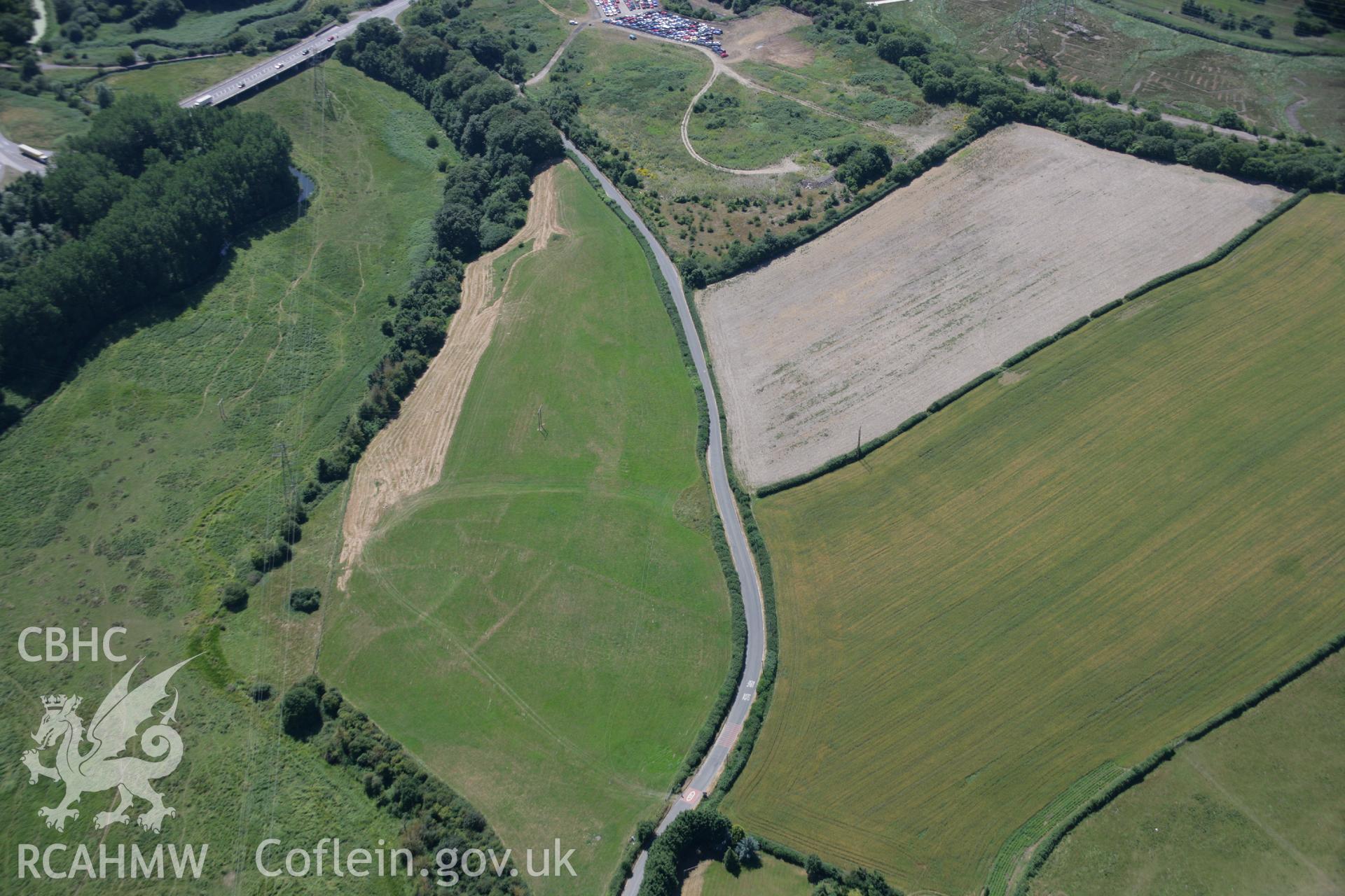 RCAHMW colour oblique aerial photograph of settlement earthworks at Llancadle Shrunken Village. Taken on 24 July 2006 by Toby Driver.