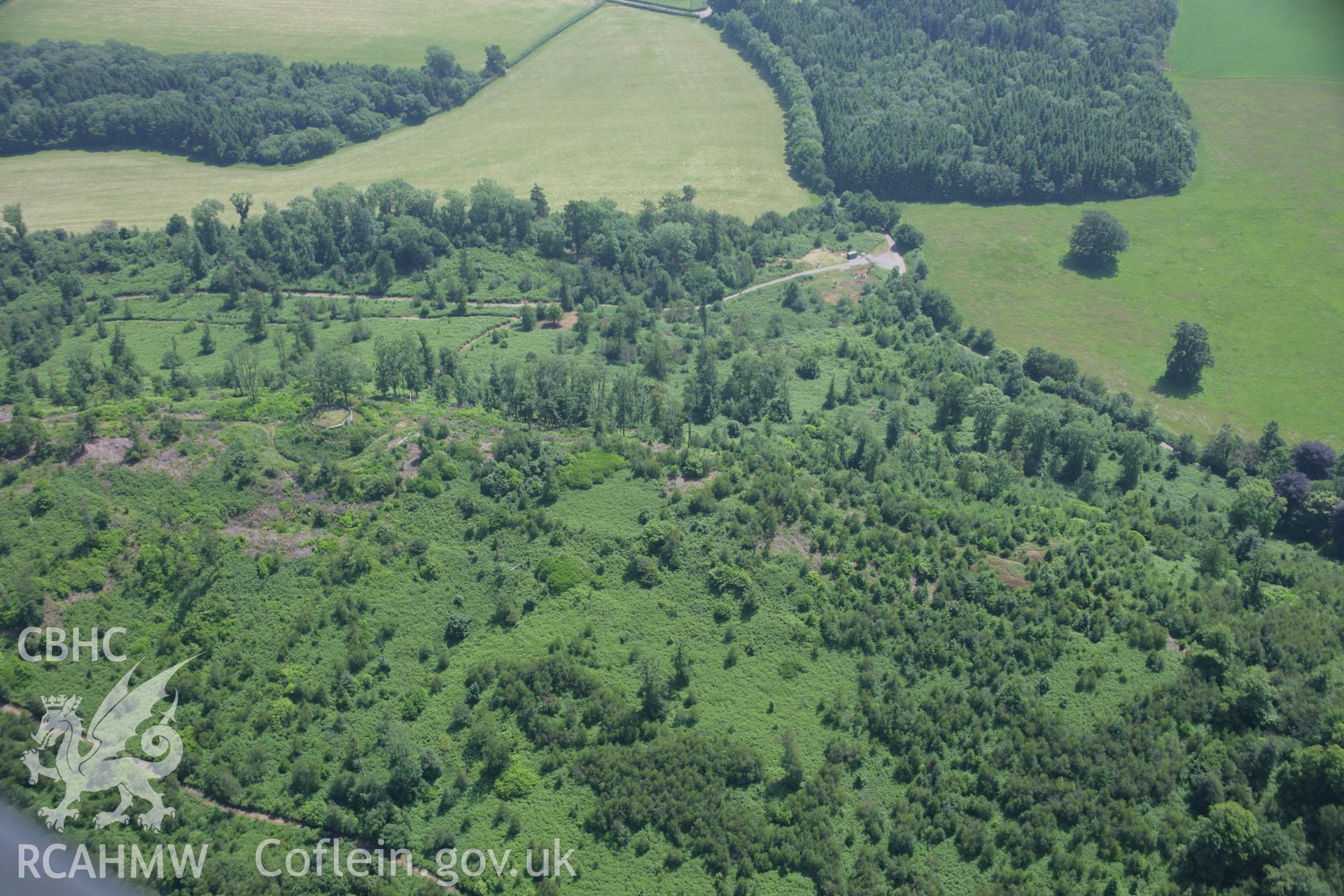 RCAHMW colour oblique photograph of Ruperra Hillfort and summerhouse. Taken by Toby Driver on 29/06/2006.