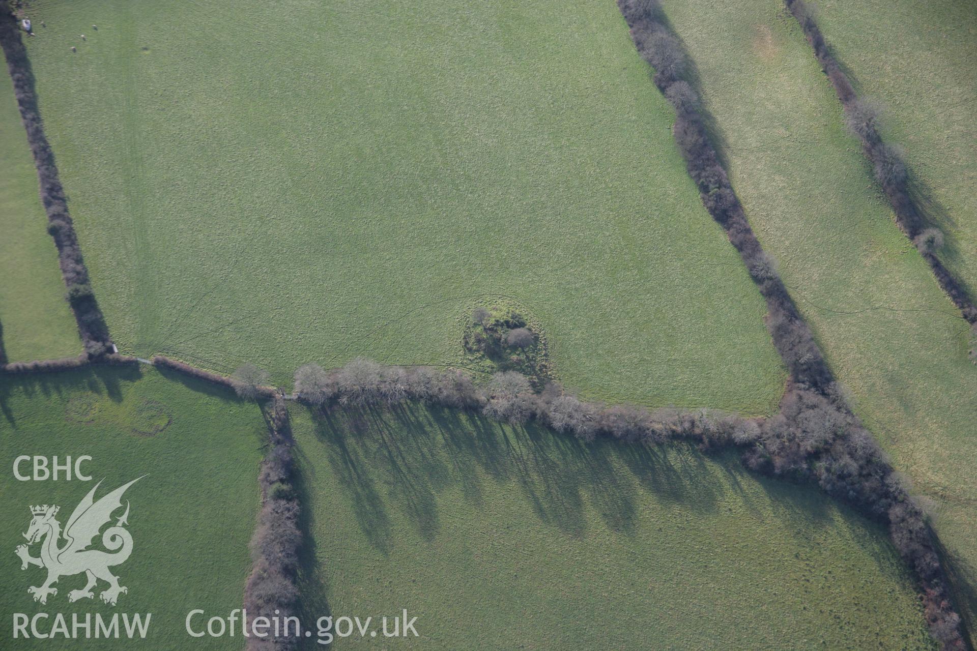 RCAHMW colour oblique aerial photograph of a round barrow north of Rosemary Lane. Taken on 11 January 2006 by Toby Driver.