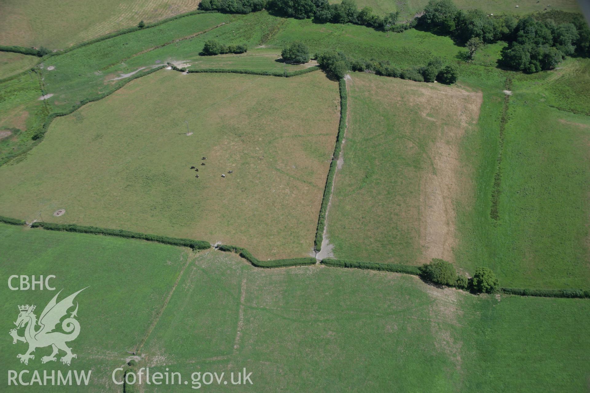 RCAHMW colour oblique aerial photograph of a cropmark enclosure south of Blaen-Lliwe. Taken on 24 July 2006 by Toby Driver.