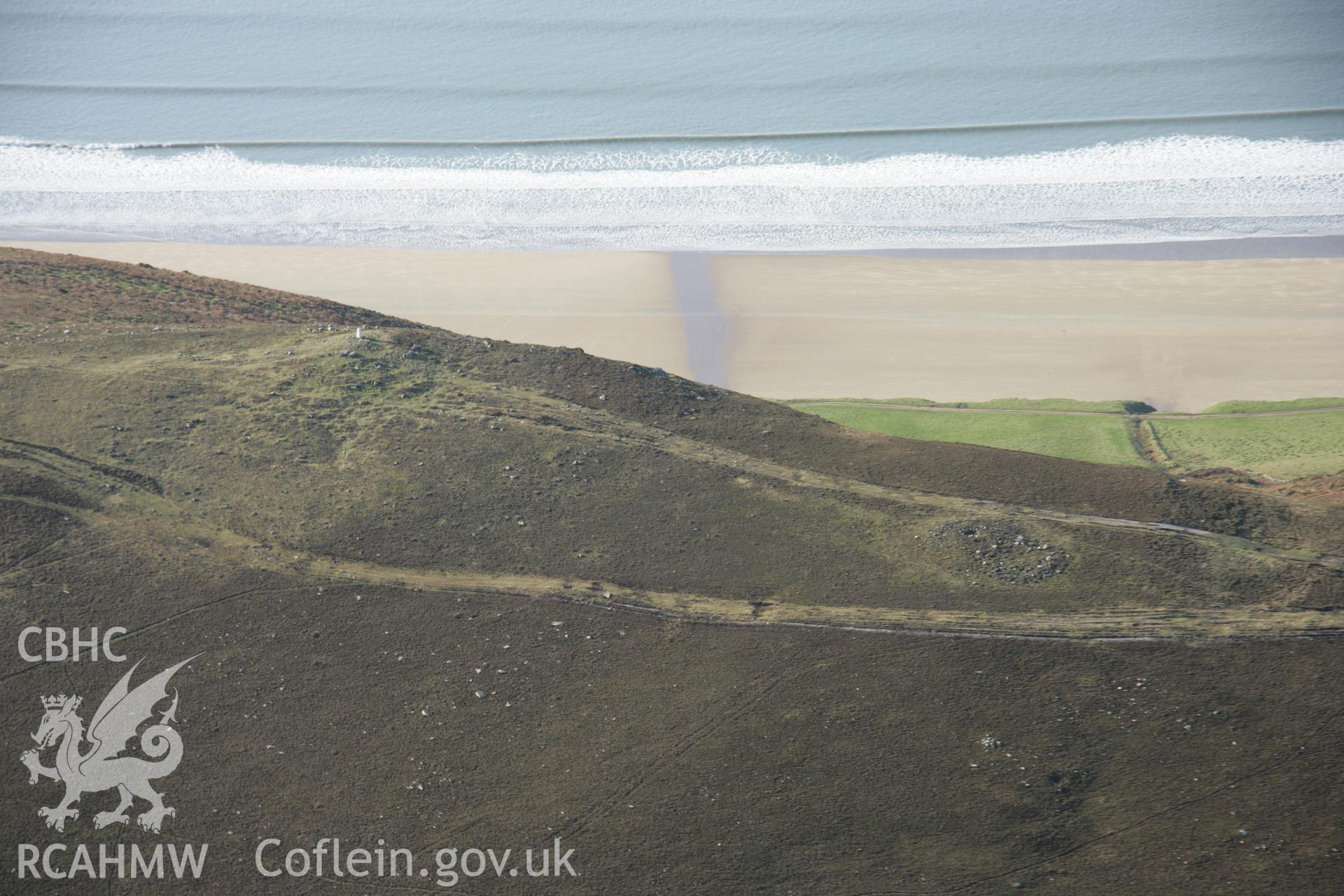 RCAHMW colour oblique aerial photograph of Rhossili Down Cairn III and The Beacon from the east. Taken on 26 January 2006 by Toby Driver.