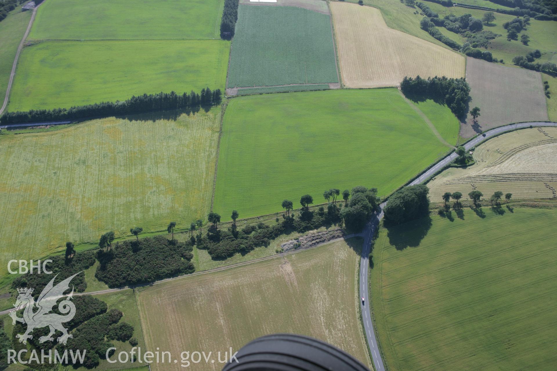 RCAHMW colour oblique aerial photograph of a section of Offa's Dyke extending 2143m south from The Firs, Rhos-y-Meirch. Taken on 13 July 2006 by Toby Driver.