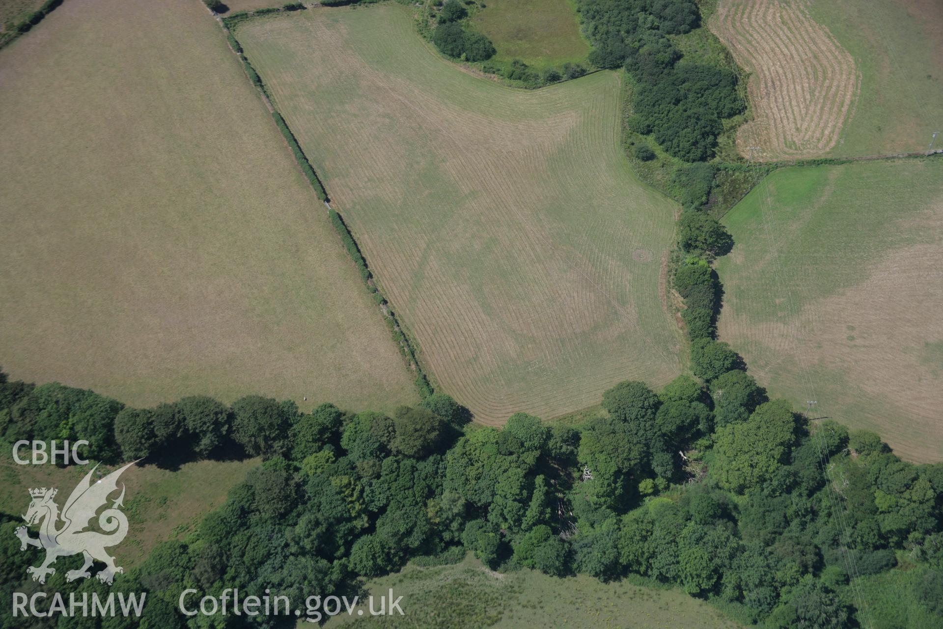 RCAHMW colour oblique aerial photograph of Bwlch y Ffordd Isa cropmark enclosure from the east. Taken on 03 August 2006 by Toby Driver.