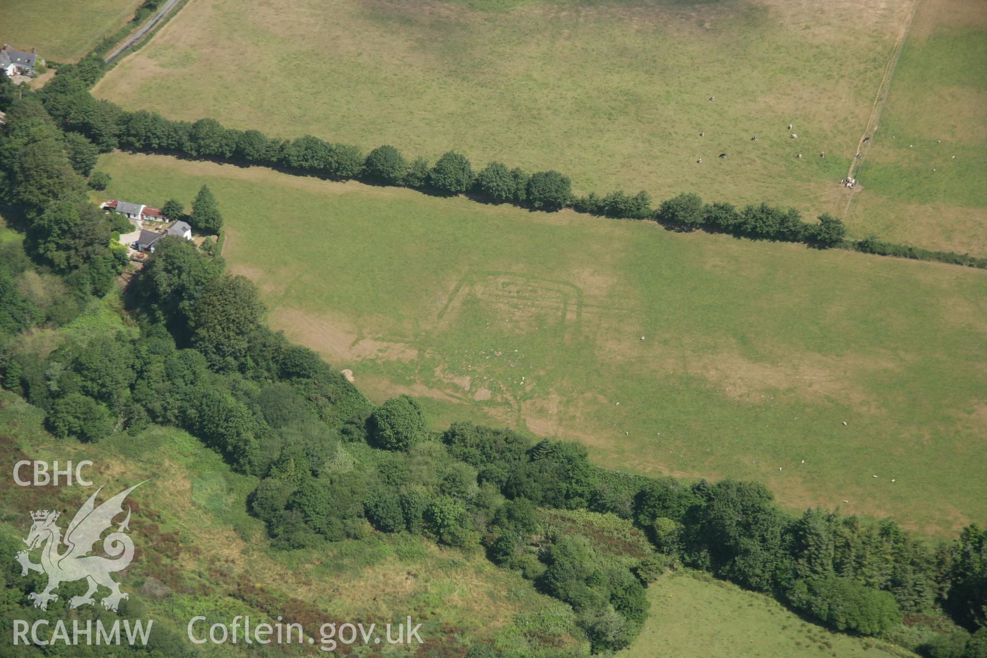 RCAHMW colour oblique aerial photograph of Pont Rhyd-Hir Defended Enclosure, Efailnewydd, from the west. Taken on 03 August 2006 by Toby Driver