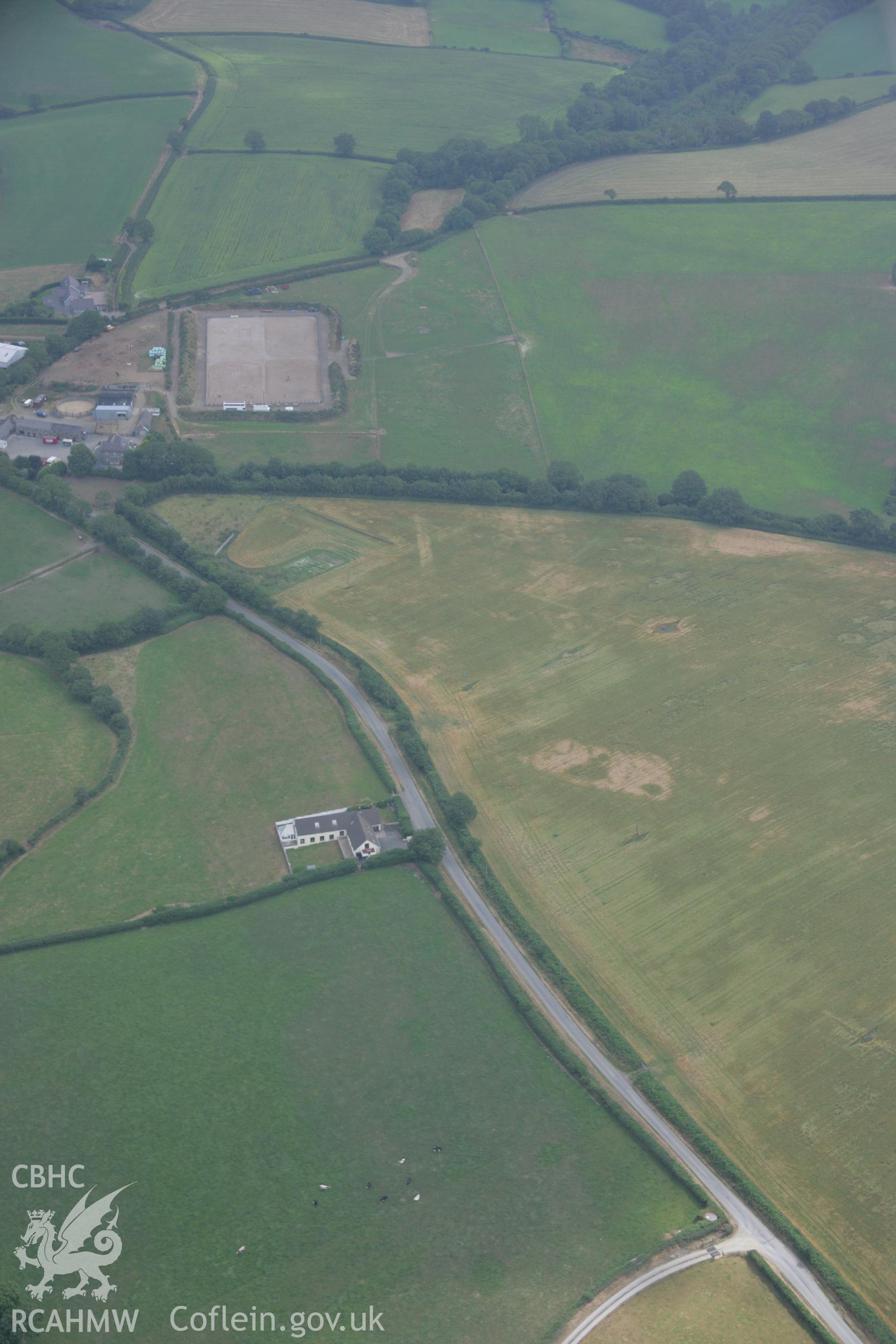 RCAHMW colour oblique aerial photograph of the Roman road west of Carmarthen at Broadway with the road showing as a cropmark. Taken on 21 July 2006 by Toby Driver.