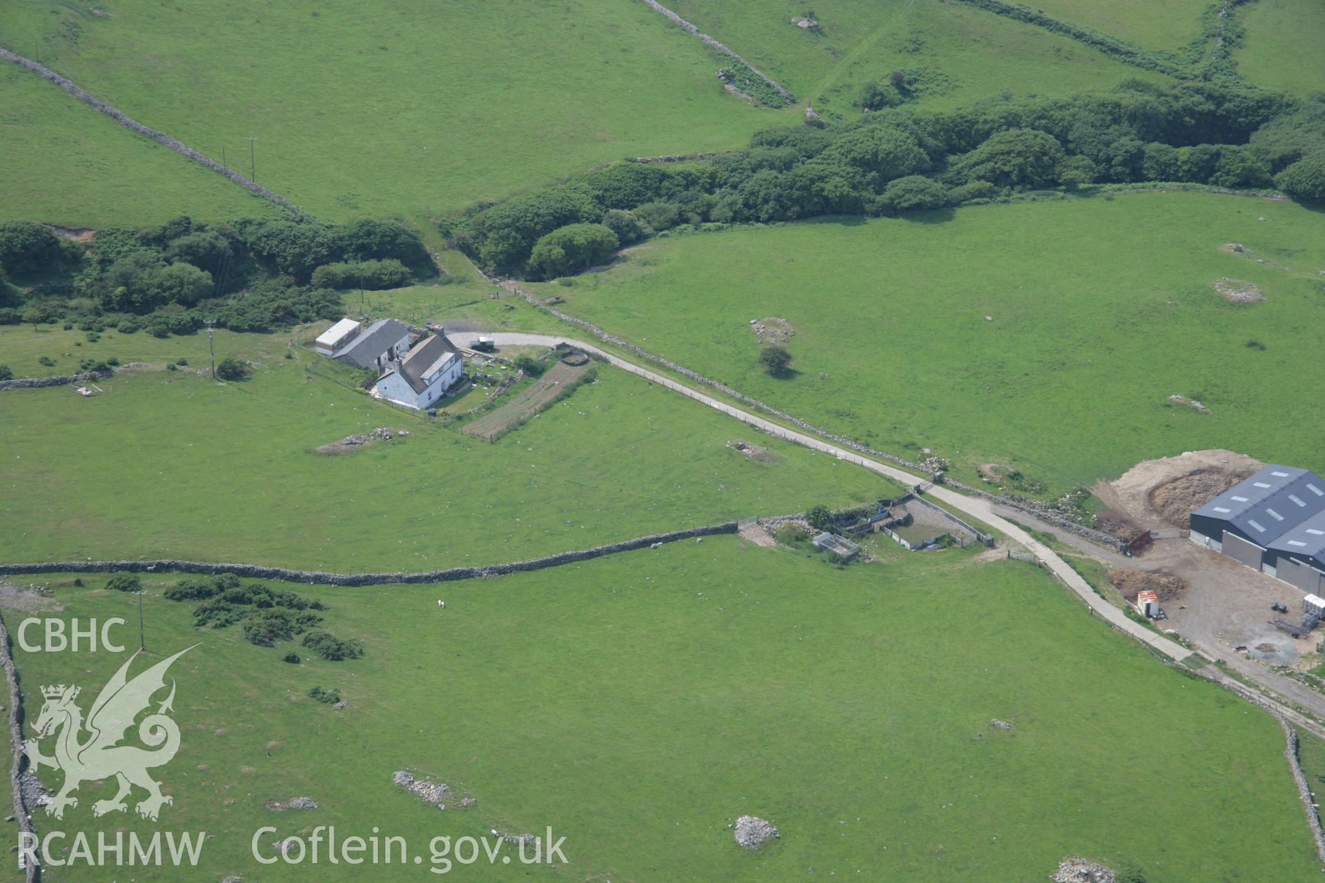 RCAHMW colour oblique aerial photograph of Carn-Gadell Uchaf Corn Drying Kiln, Llwyngwril. Taken on 04 July 2006 by Toby Driver.