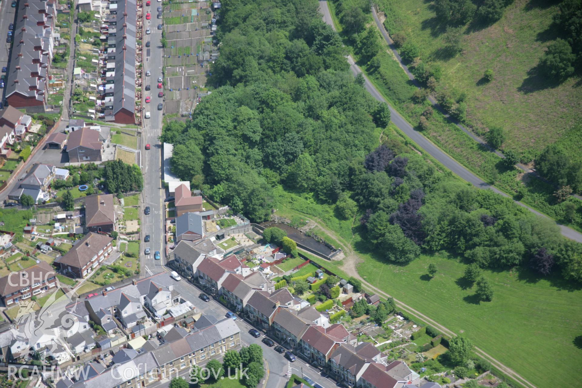 RCAHMW colour oblique aerial photograph of a former dam at the Cwmcarn Canal Reservoir from the west. Taken on 09 June 2006 by Toby Driver.