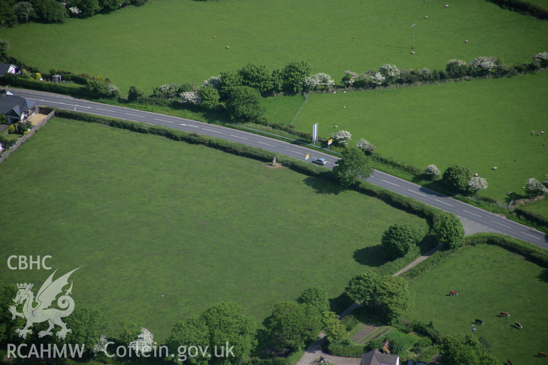 RCAHMW colour oblique aerial photograph of the Lady Stone (Ty Meini), standing stone, viewed from the north-west. Taken on 08 June 2006 by Toby Driver