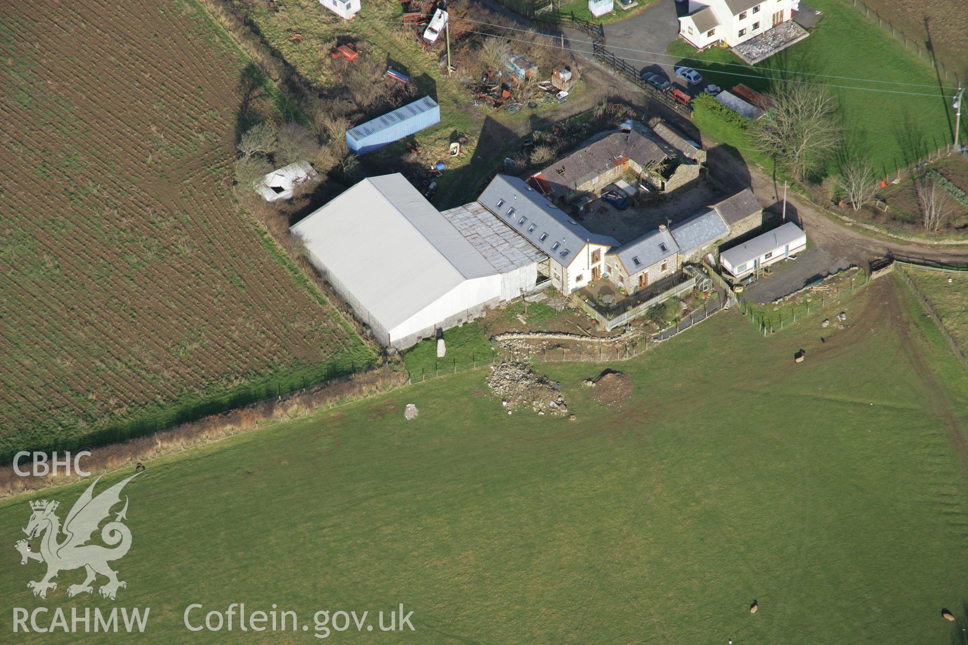 RCAHMW colour oblique aerial photograph of Ty'r-Coed Stone from the south-west. Taken on 26 January 2006 by Toby Driver.