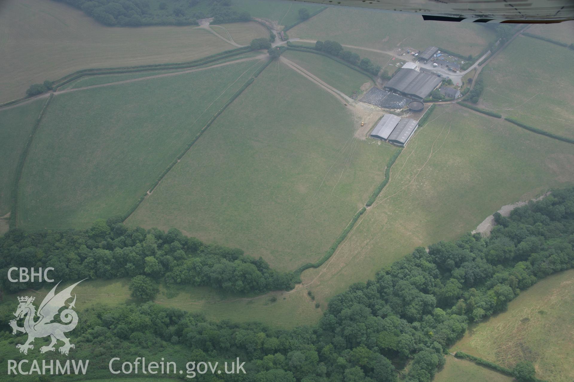 RCAHMW colour oblique aerial photograph of enclosure, Henllan Farm I. Taken on 21 July 2006 by Toby Driver.