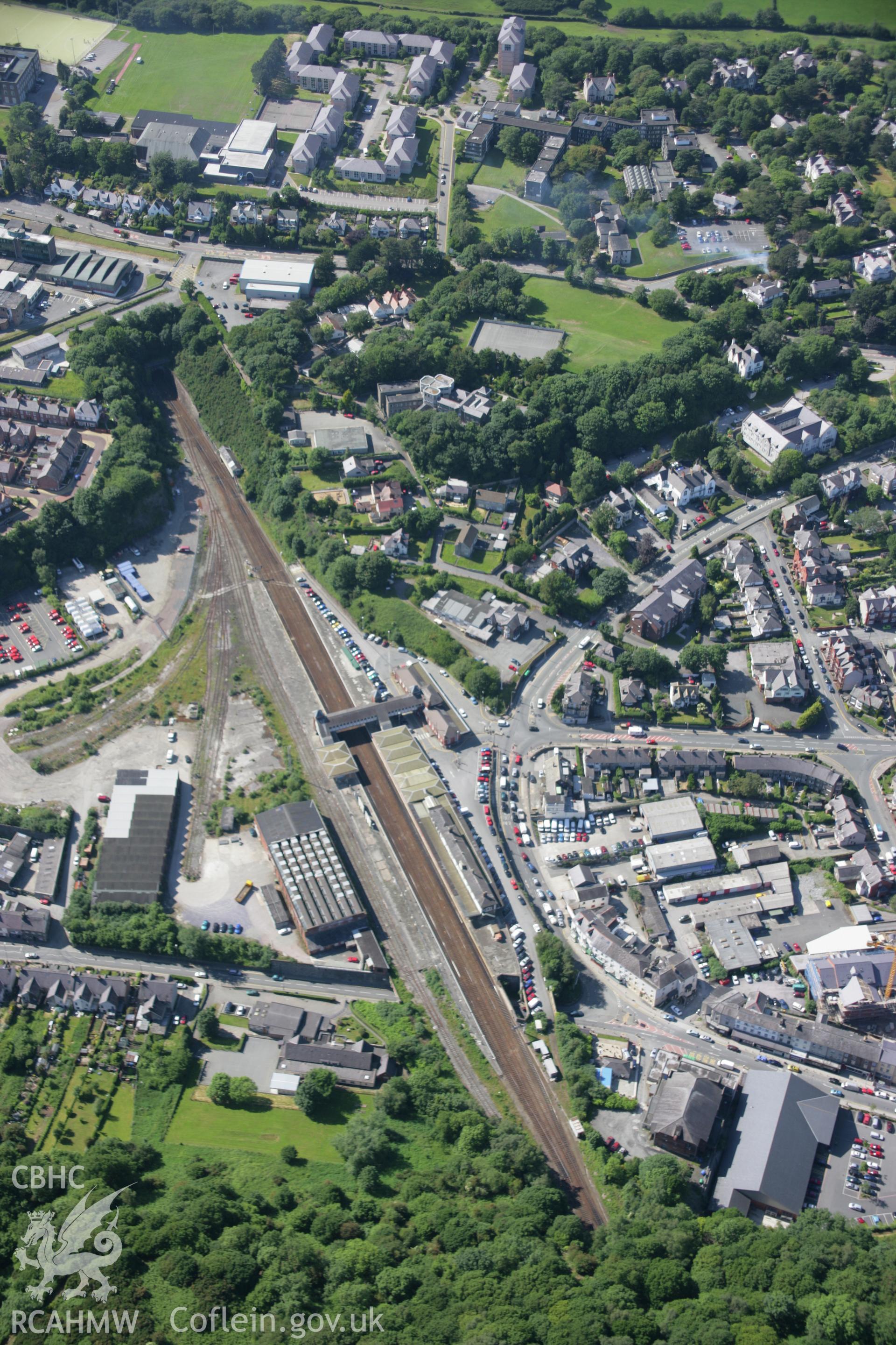 RCAHMW colour oblique aerial photograph of Bangor Railway Station from the south-east. Taken on 14 June 2006 by Toby Driver.