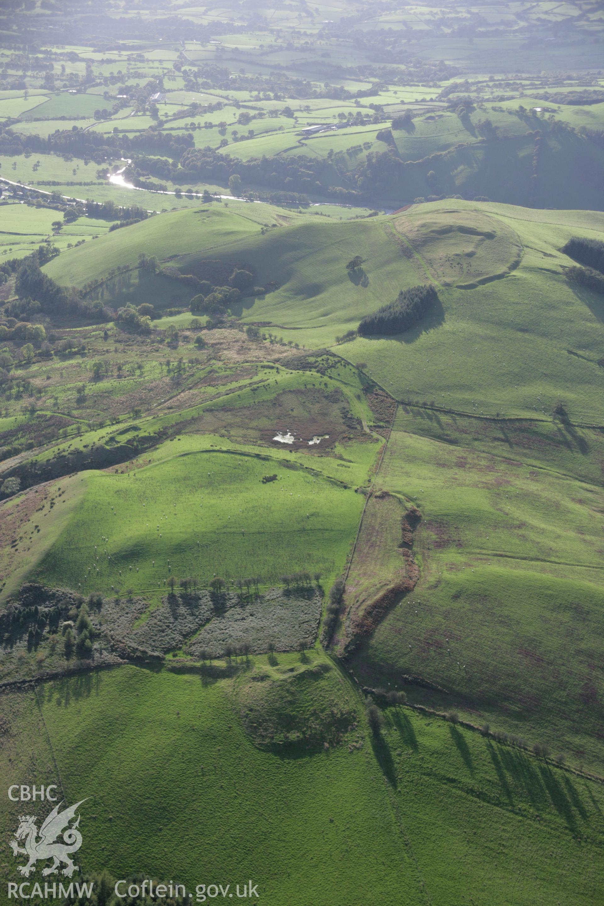 RCAHMW colour oblique aerial photograph of Cefn-y-Gaer Enclosure looking west. Taken on 13 October 2005 by Toby Driver