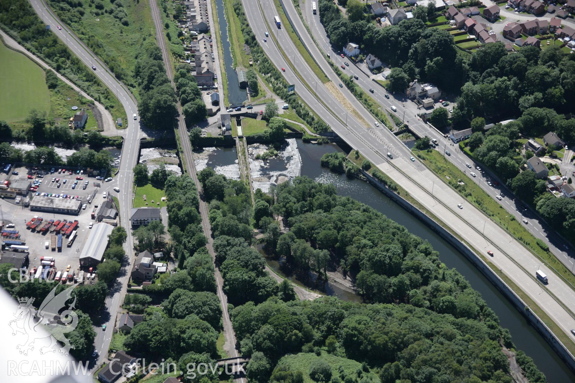 RCAHMW colour oblique aerial photograph of Aberdulais Aqueduct, and Vale of Neath Railway Bridge, viewed from the north-west. Taken on 22 June 2005 by Toby Driver