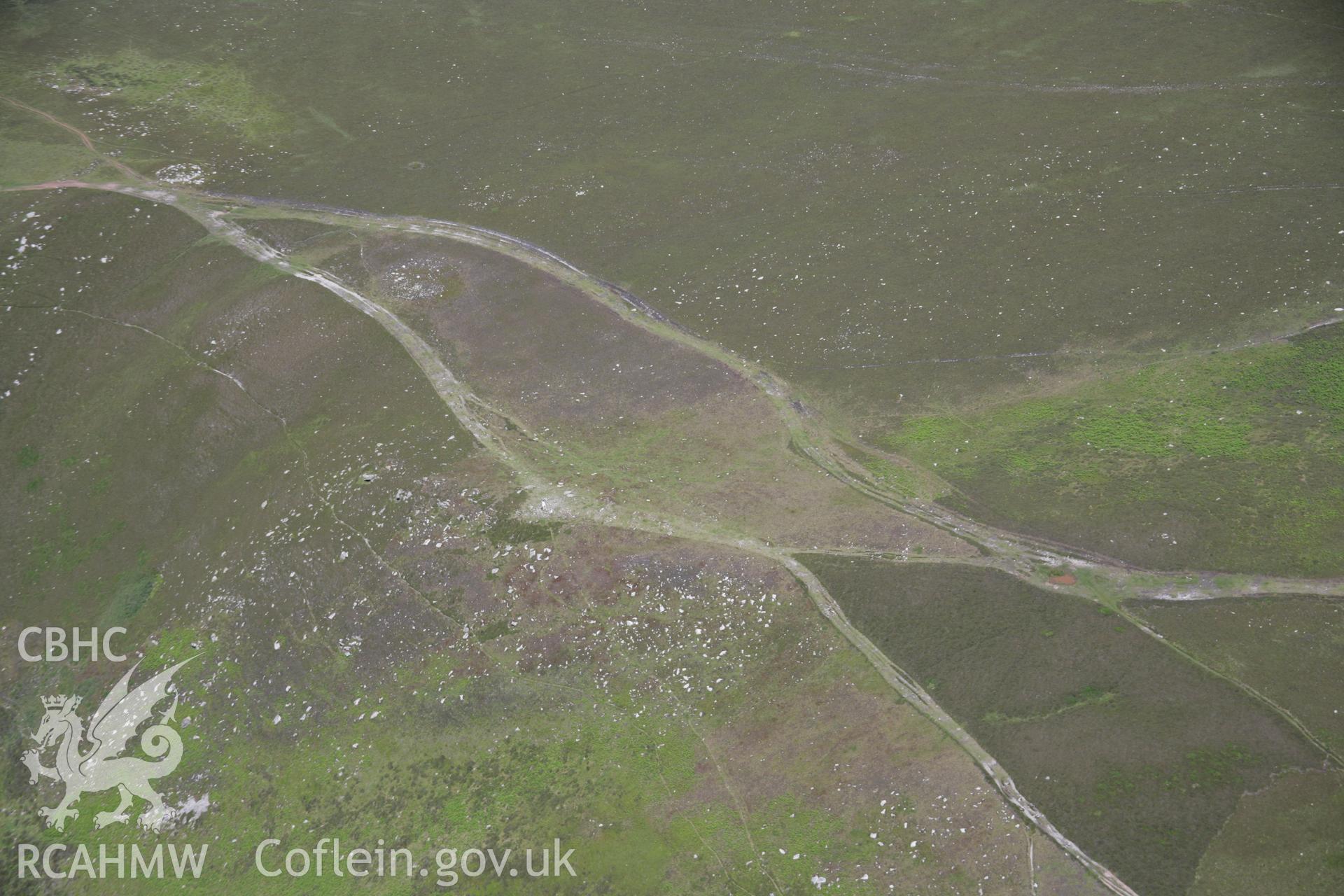 RCAHMW colour oblique aerial photograph of Rhossili Down Cairn II, viewed from the south-west. Taken on 22 June 2005 by Toby Driver