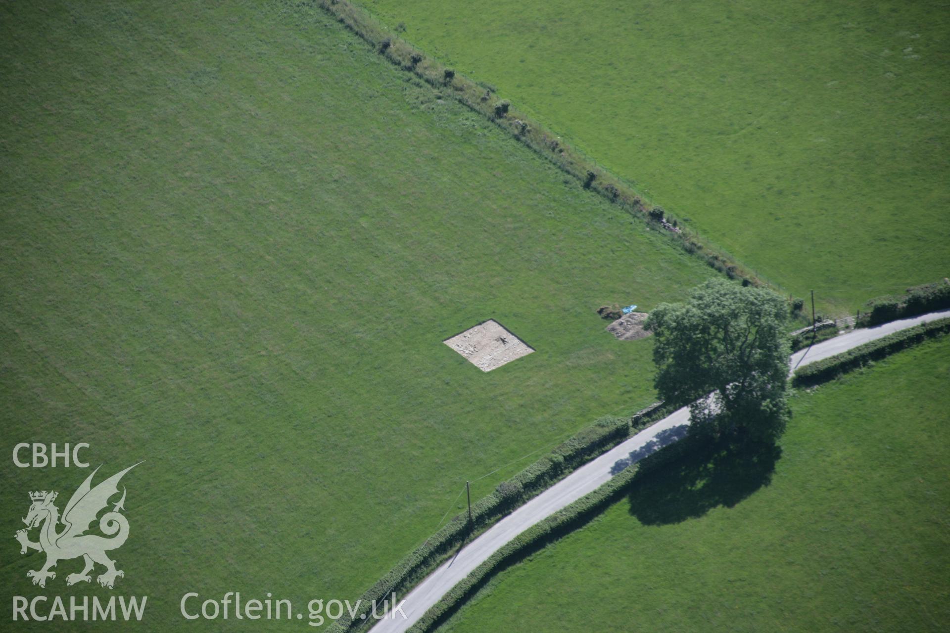 RCAHMW colour oblique aerial photograph of the gatehouse of the Strata Florida Abbey Precinct showing precinct excavations to the west of the abbey. Taken on 23 June 2005 by Toby Driver