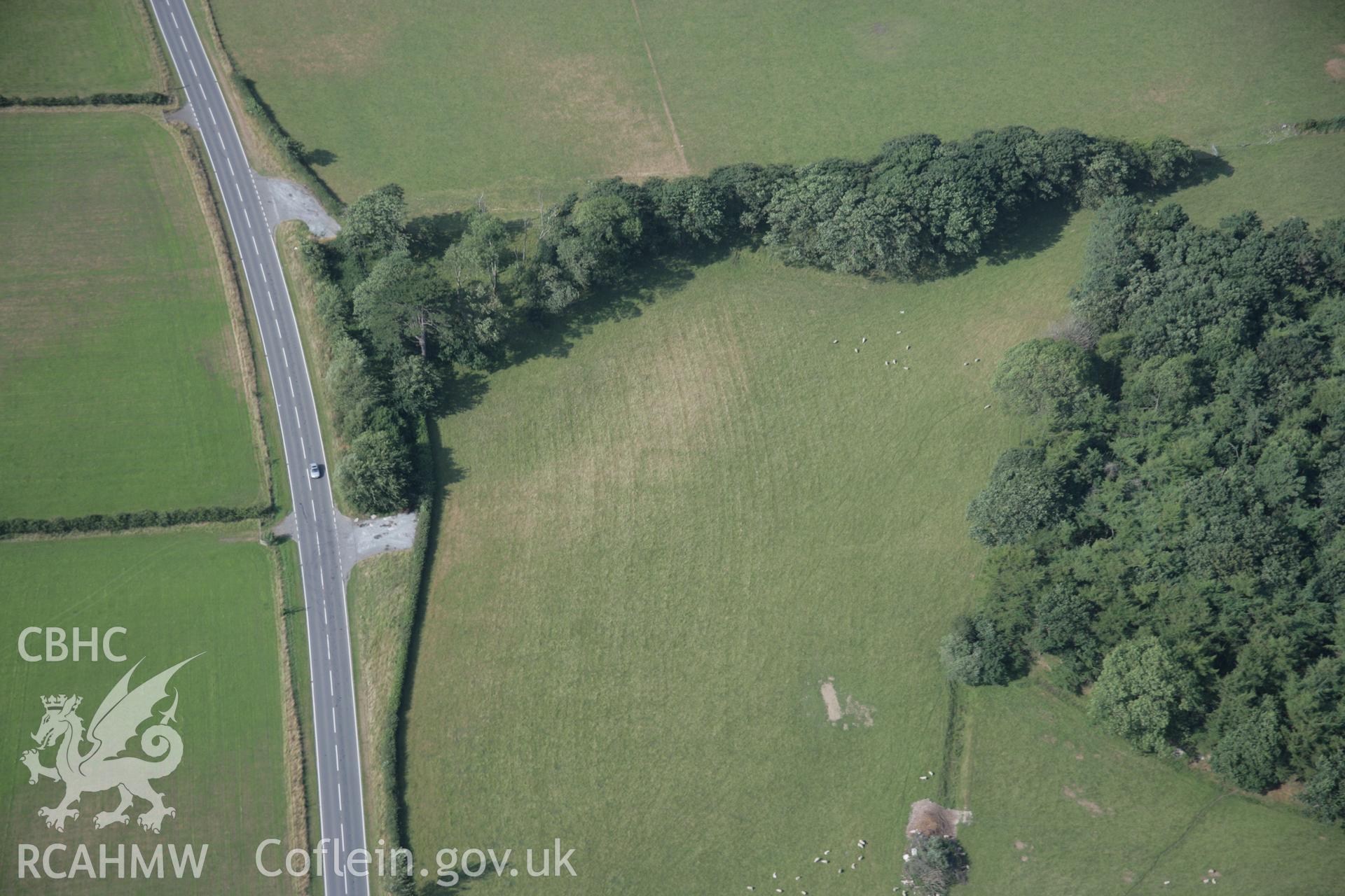 RCAHMW digital colour oblique photograph of the faint cropmarks of Croes-faen Square Barrow Cemetery viewed from the north-east. Taken on 27/07/2005 by T.G. Driver.