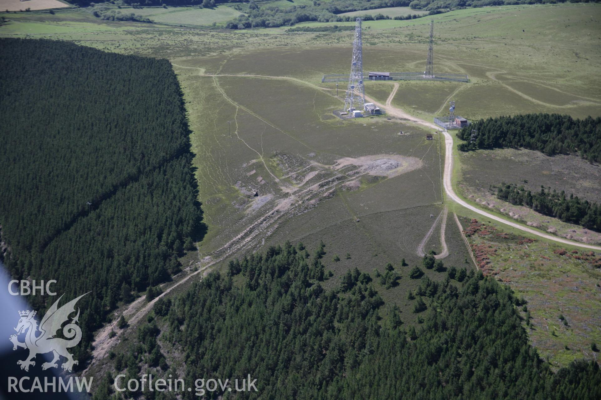 RCAHMW colour oblique aerial photograph of Foel Fynyddau Cairn and the copper works flue. A general view from the east. Taken on 22 June 2005 by Toby Driver