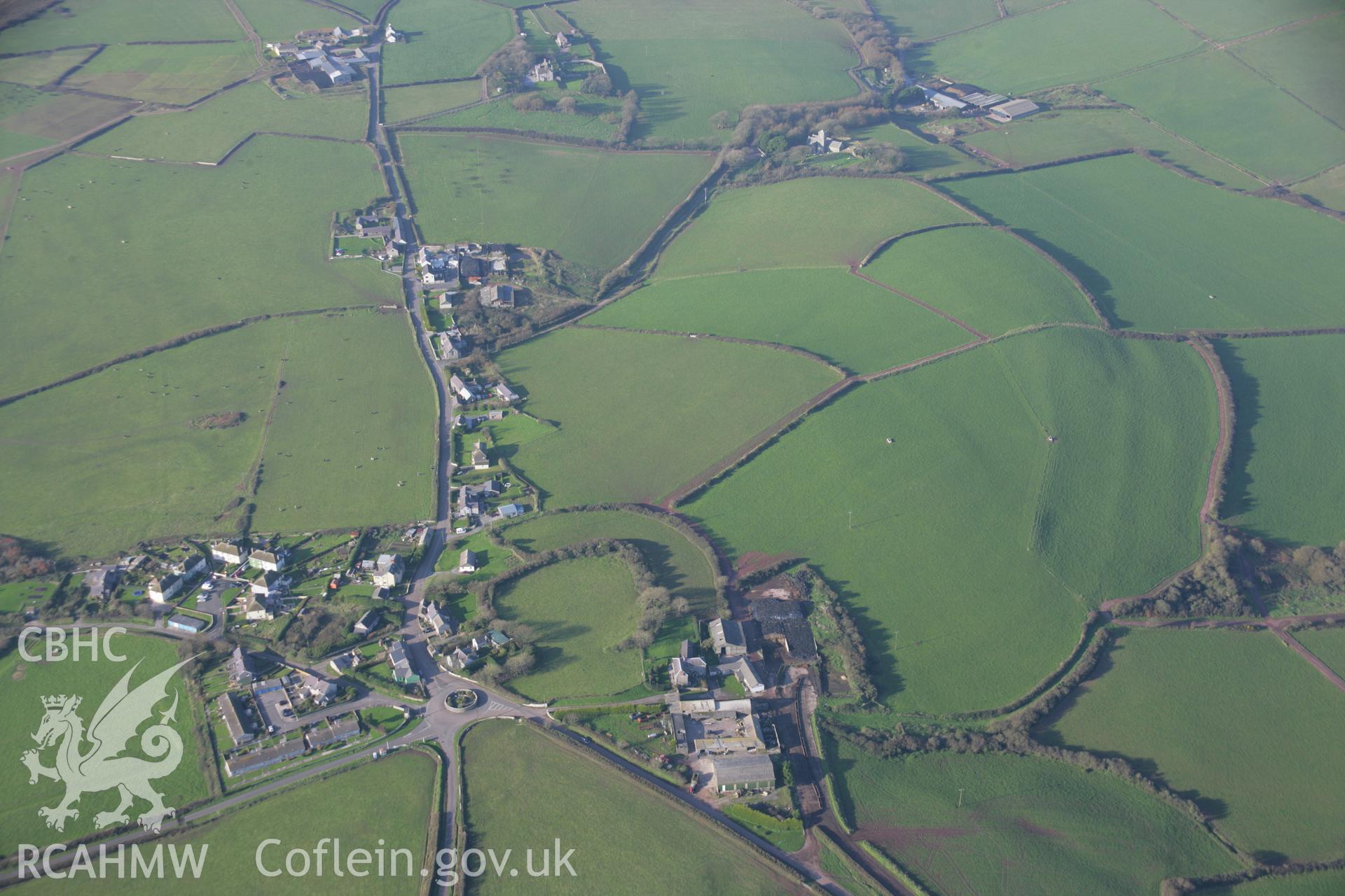 RCAHMW colour oblique aerial photograph of Castlemartin Castle from the south-east with field systems beyond. Taken on 19 November 2005 by Toby Driver