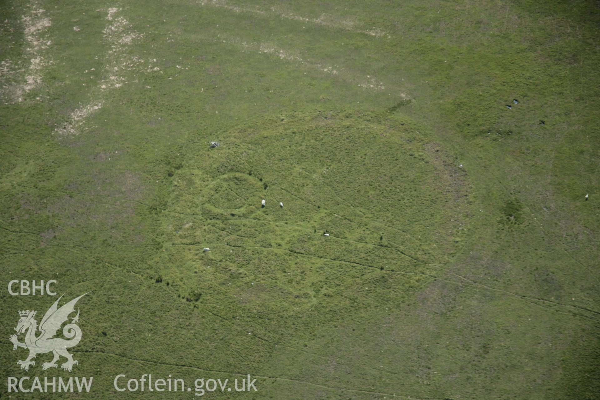 RCAHMW colour oblique aerial photograph of Twyn Tyle (North) Ring Barrow (Graig Fawr Ring Monument). Taken on 09 June 2005 by Toby Driver