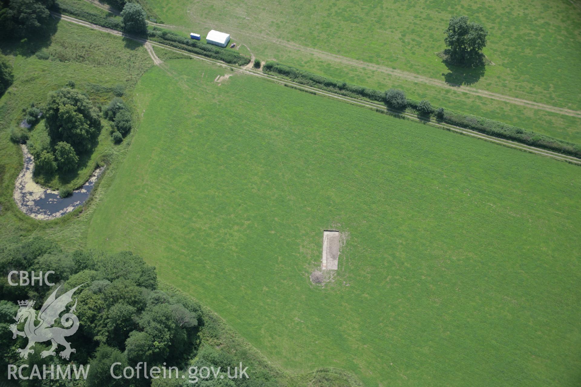 RCAHMW colour oblique aerial photograph of Dinefwr Park Roman Forts. An evaluation trench at SN 6203 2279 viewed from the north. Taken on 11 July 2005 by Toby Driver